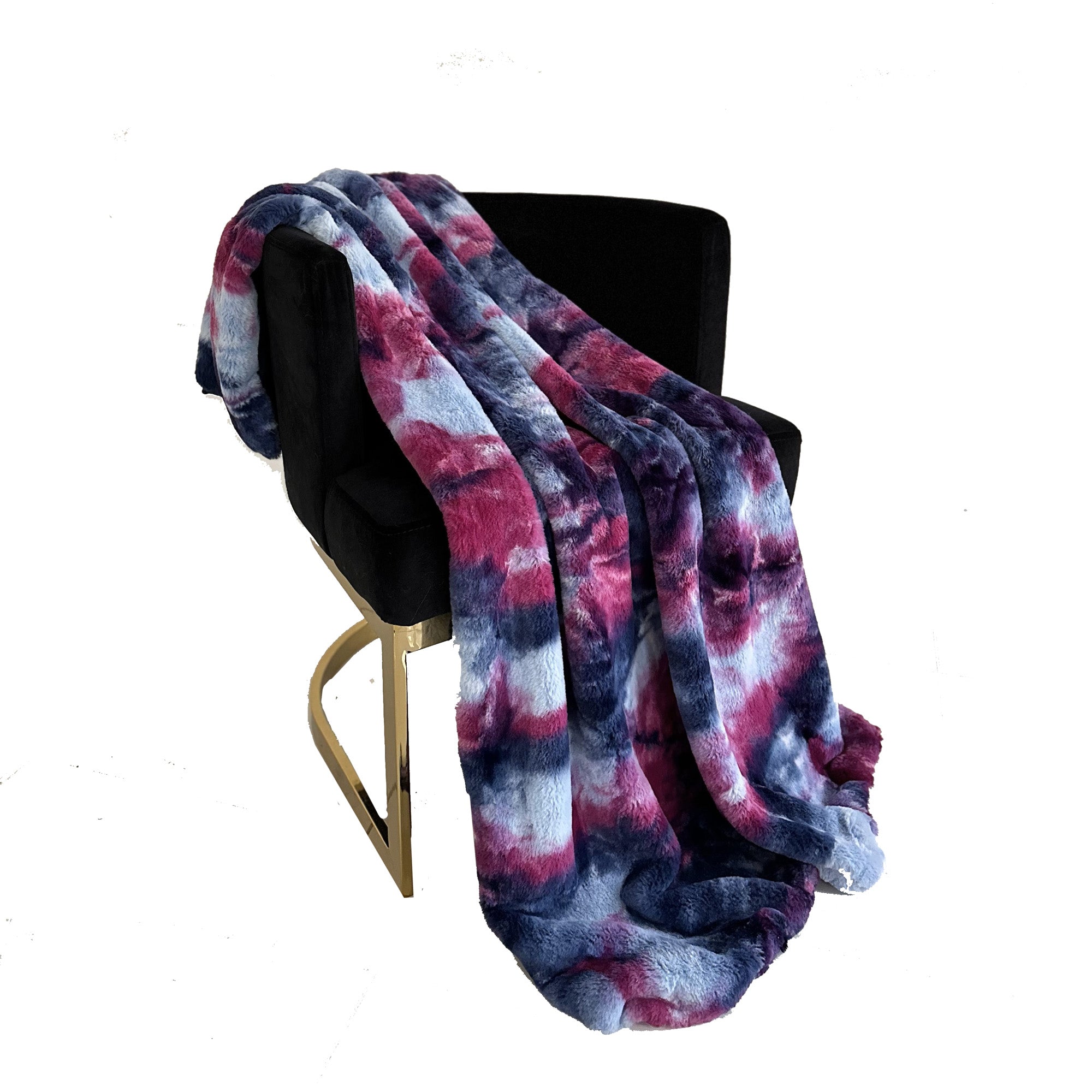 Plutus Purple Pink Faux Fur Luxury Throw Blanket draped elegantly over a chair, showcasing its plush texture and vibrant color.