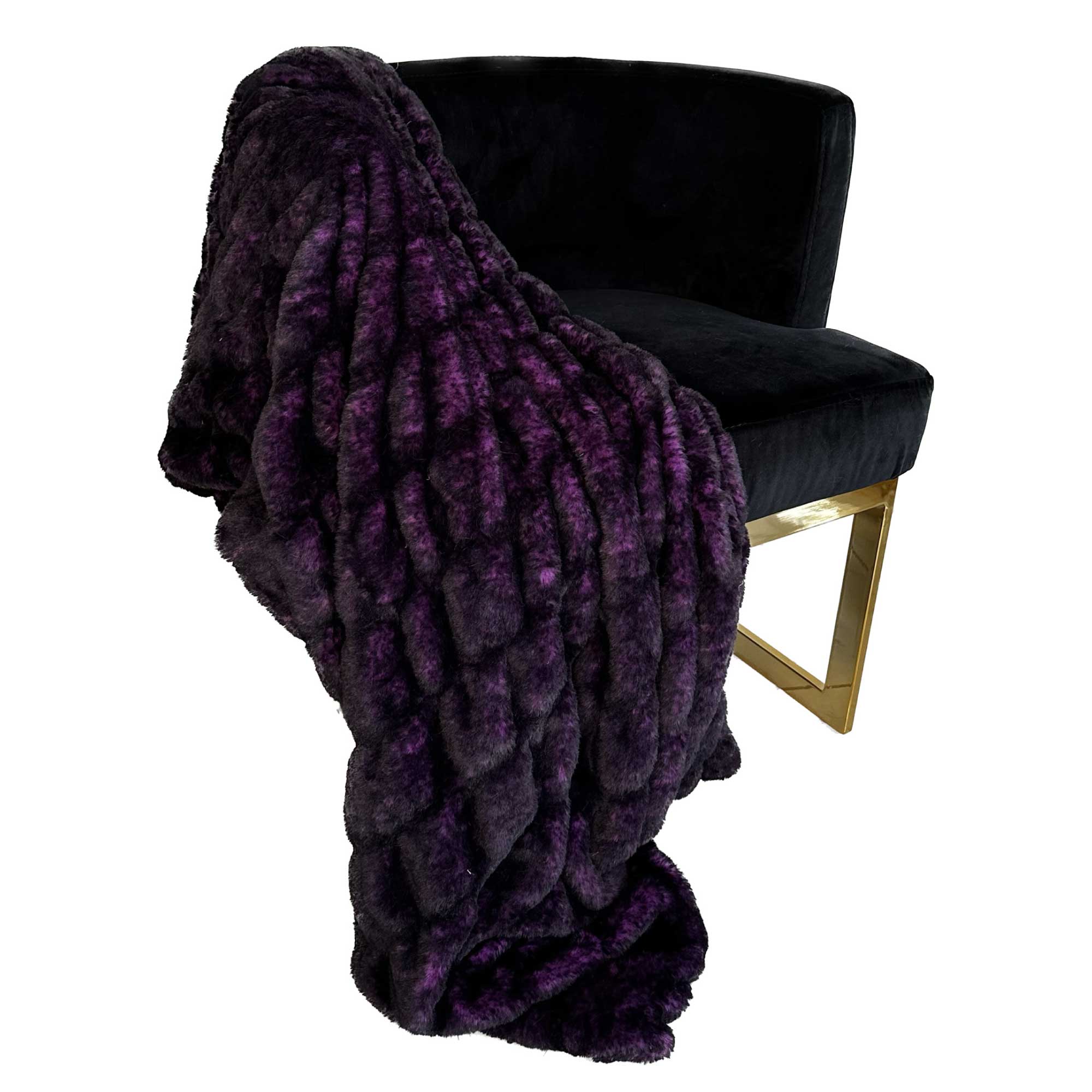 Plutus Purple Plush Pelt Faux Fur Luxury Throw Blanket draped elegantly on a couch, showcasing its rich purple color and soft texture.