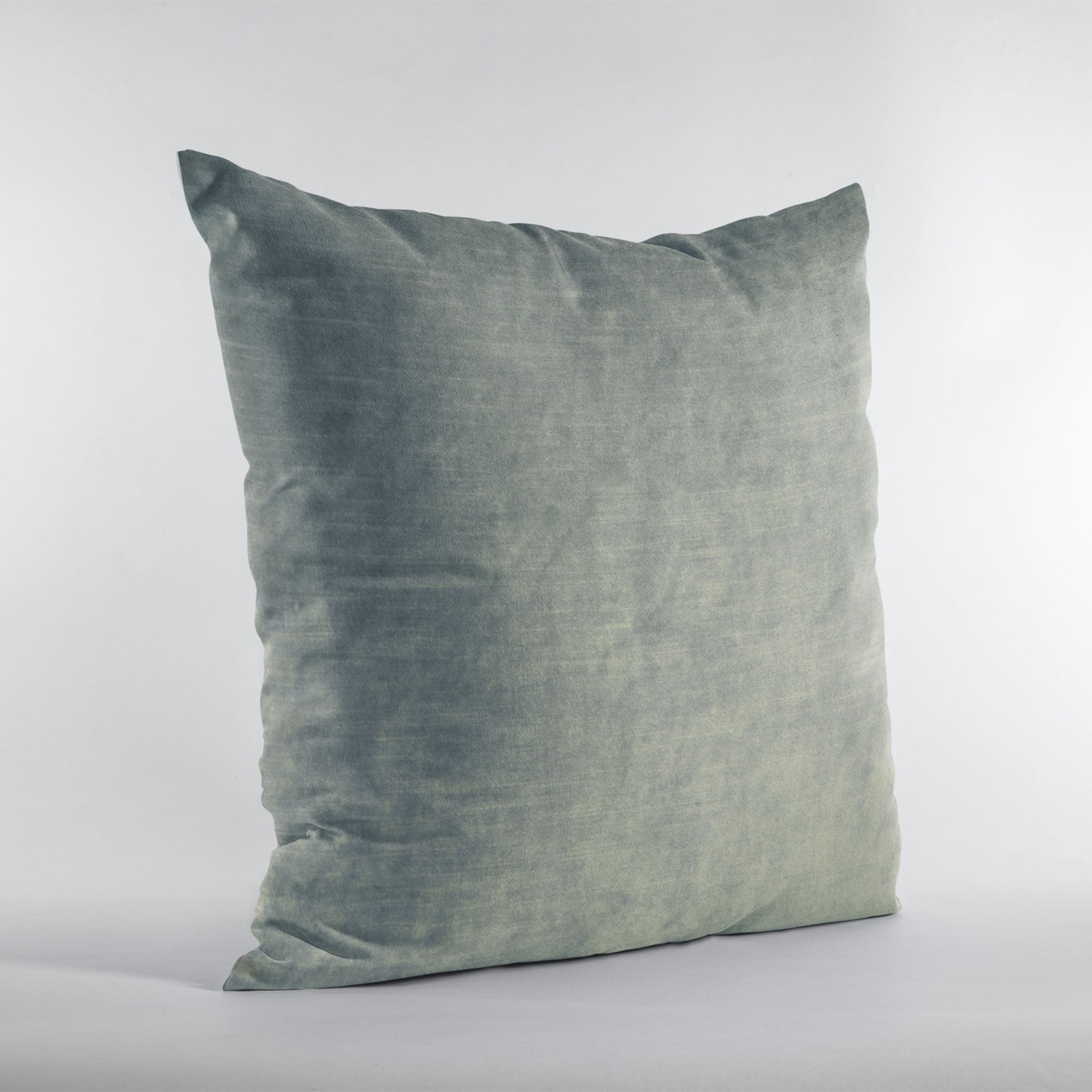 Plutus Sterling Lux Velvet Luxury Throw Pillow in shiny velvet fabric, showcasing its elegant sterling color and invisible zipper closure.