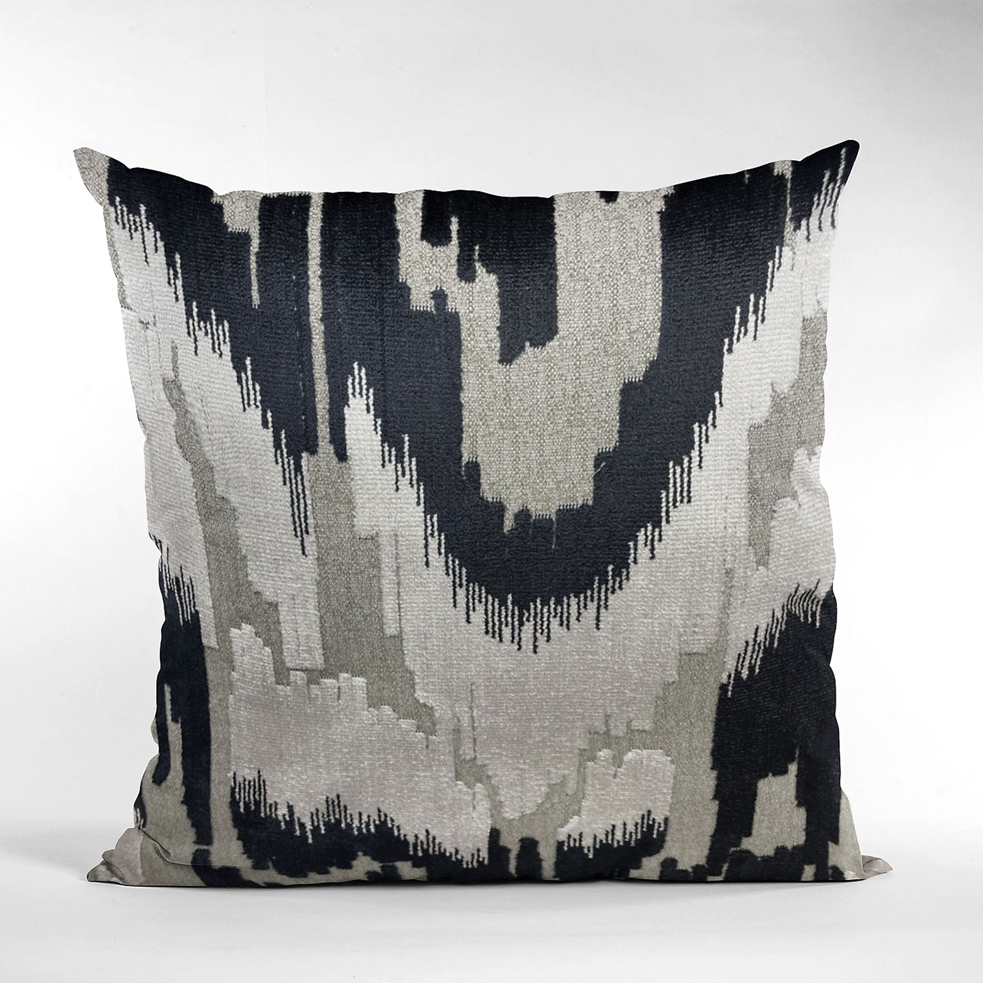 Plutus Velvet Glamour Pillow in black, gray, and cream with Ikat pattern, showcasing its luxurious handmade quality and elegant design.