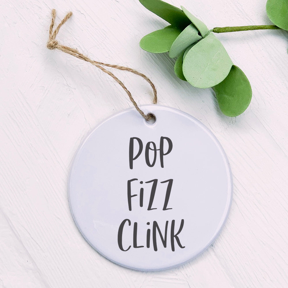 Pop Fizz Clink Ornament made of high-quality porcelain with a vibrant design, perfect for holiday decor and gift tags.