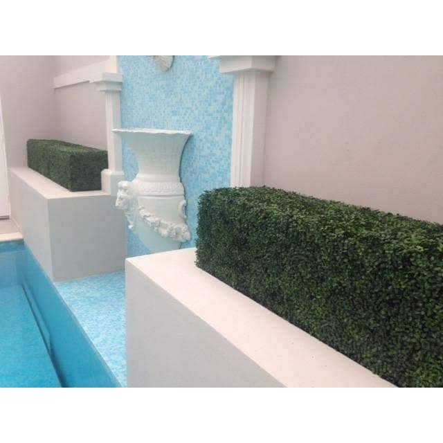 Portable Artificial Boxwood Hedge measuring 75cm x 75cm, UV resistant, perfect for outdoor use, providing instant greenery and privacy.