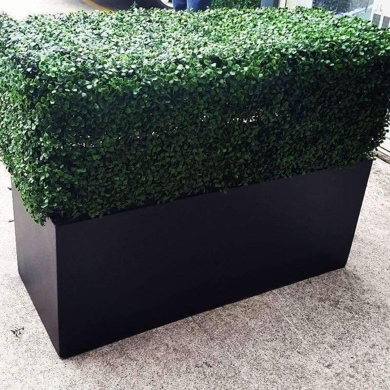Portable Artificial Boxwood Hedge measuring 75cm x 75cm, UV resistant, perfect for outdoor use, providing instant greenery and privacy.