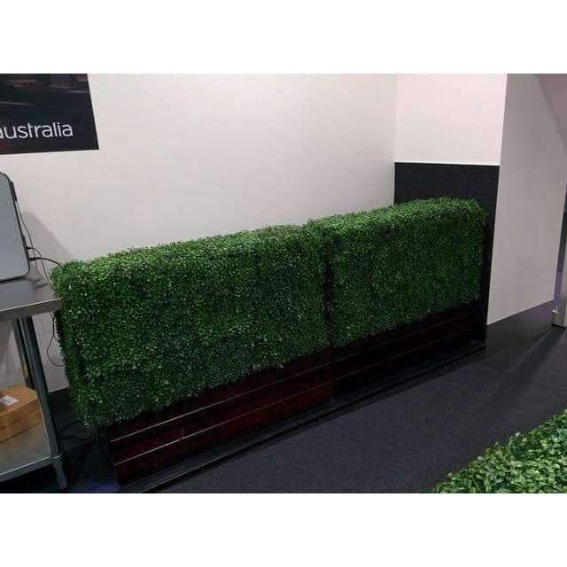 Portable Artificial Boxwood Hedge measuring 75cm x 75cm, UV resistant, perfect for outdoor use, providing instant greenery and privacy.
