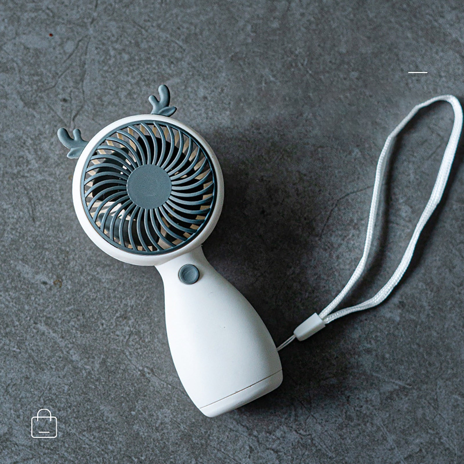 Portable Mini Fan in cartoon design, USB rechargeable, perfect for outdoor use.