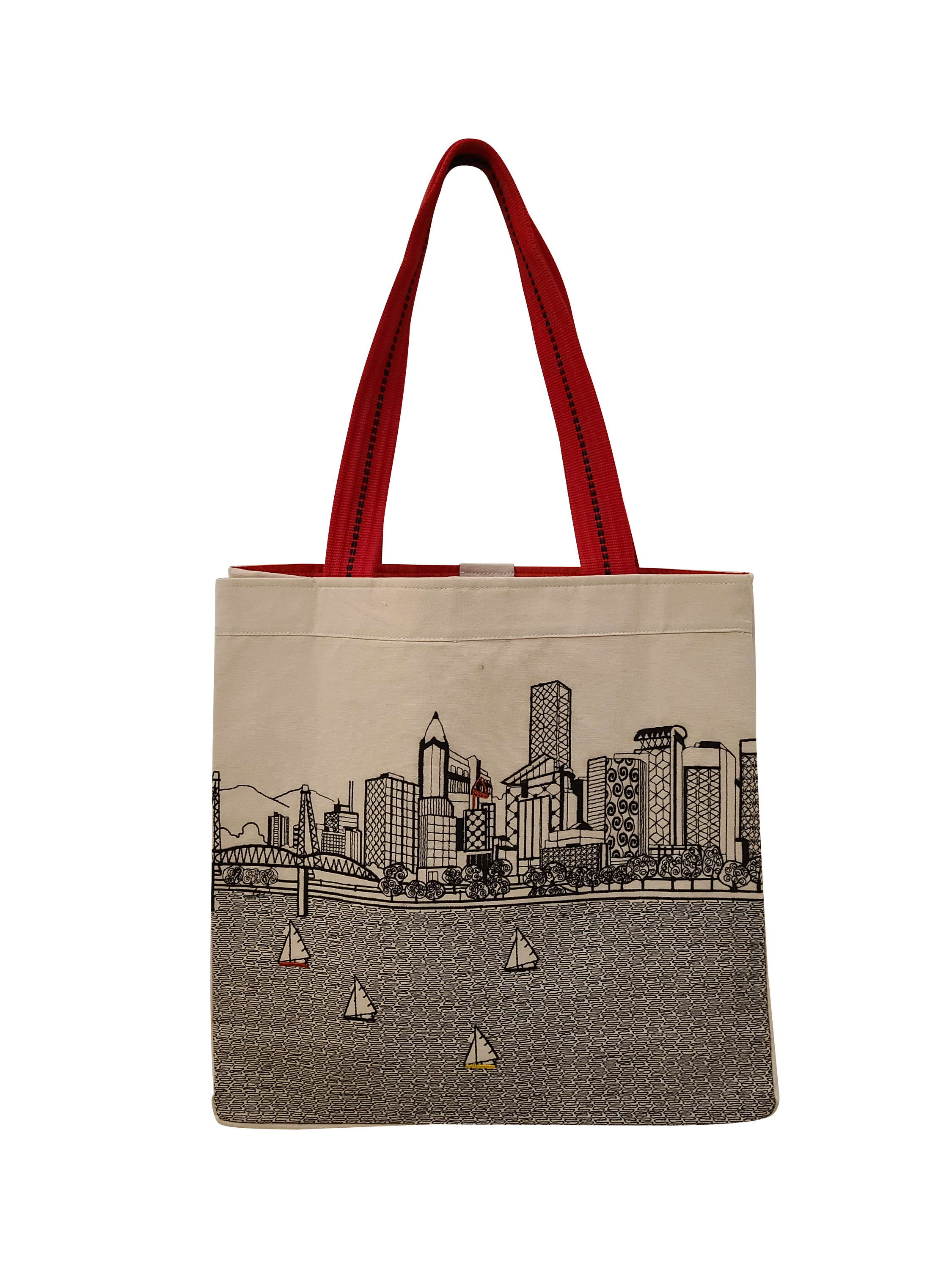 Portland Tote Bag featuring embroidered skyline design on cream and black cotton canvas with red straps.