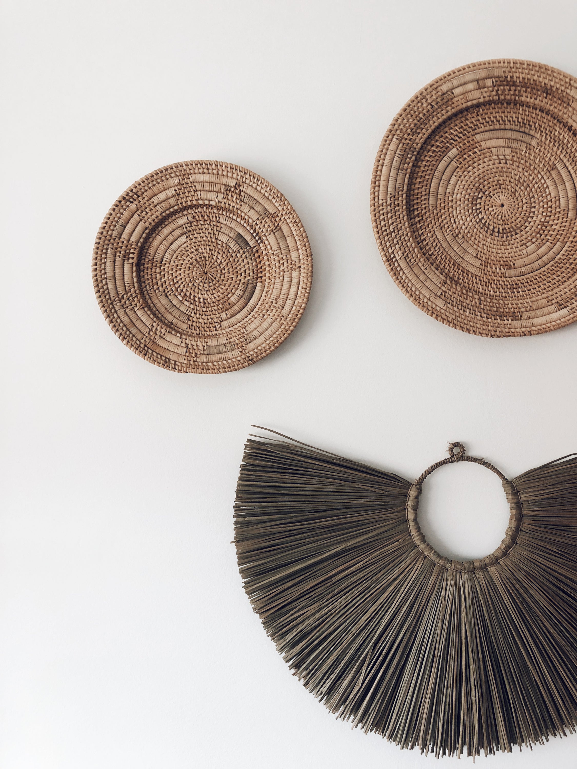 Handmade 40cm rattan wall decoration featuring intricate weaving patterns, perfect for boho and tribal decor.