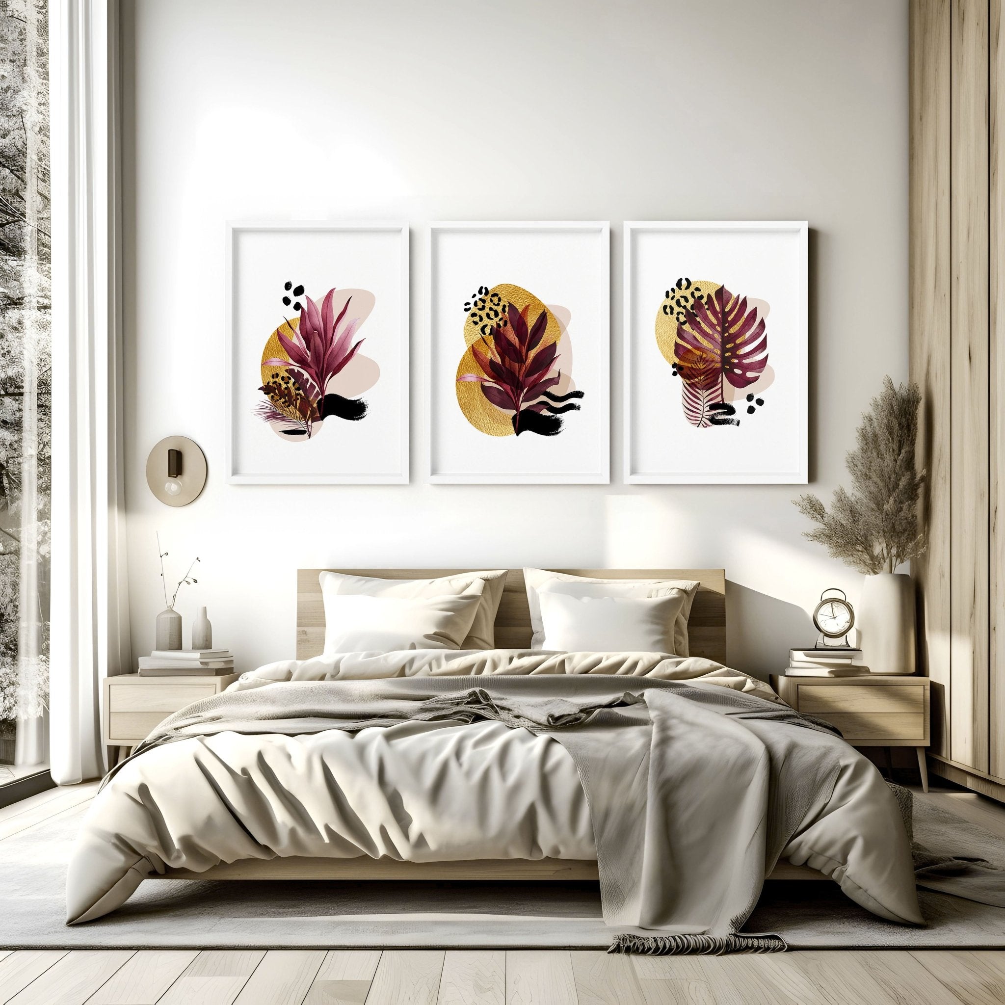 Set of 3 vibrant tropical botanical wall art prints in rich burgundy and gold tones, perfect for bedroom decor.
