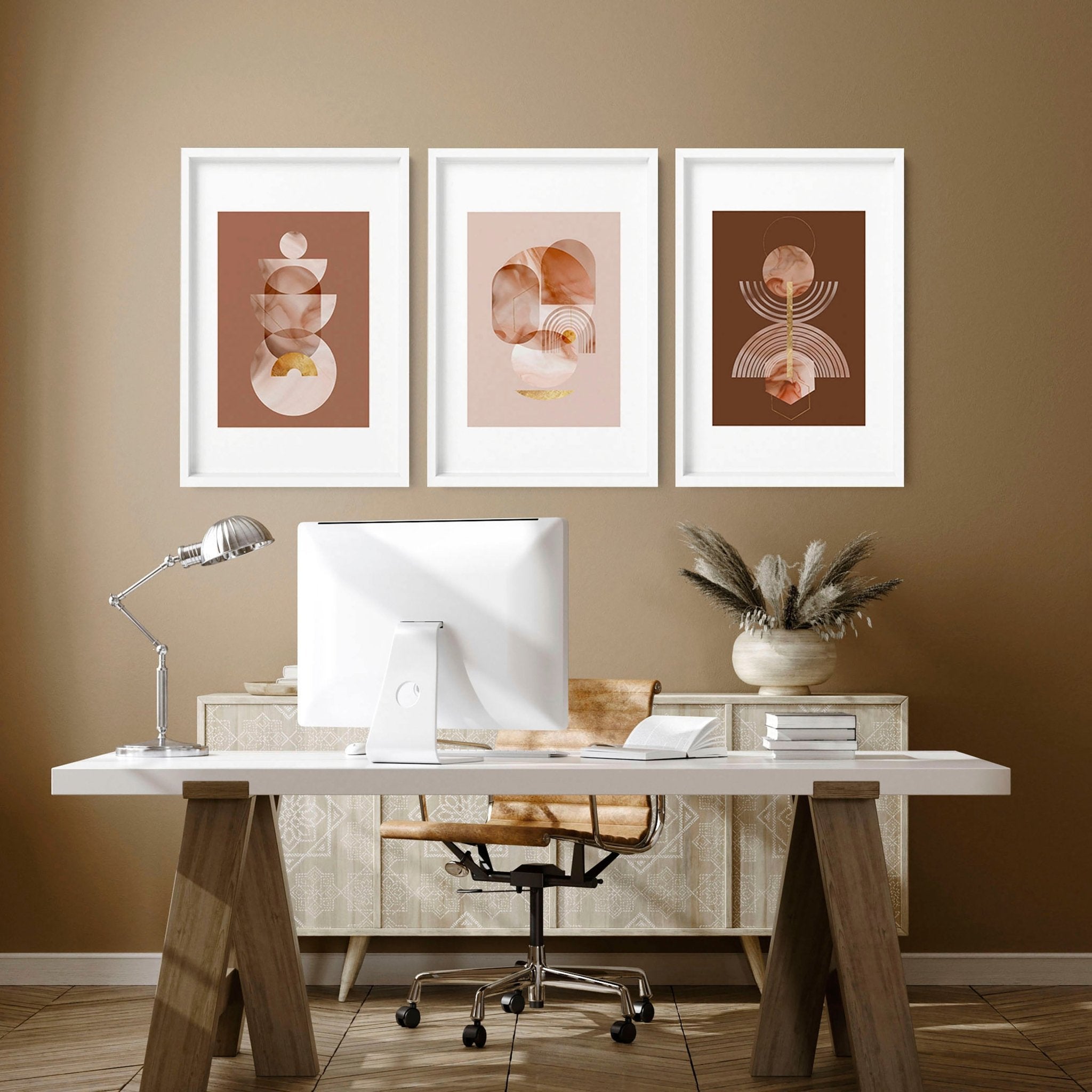 Set of 3 framed wall art prints featuring mid-century designs in Terracotta, Peach, and Muted Gold colors, perfect for office decor.