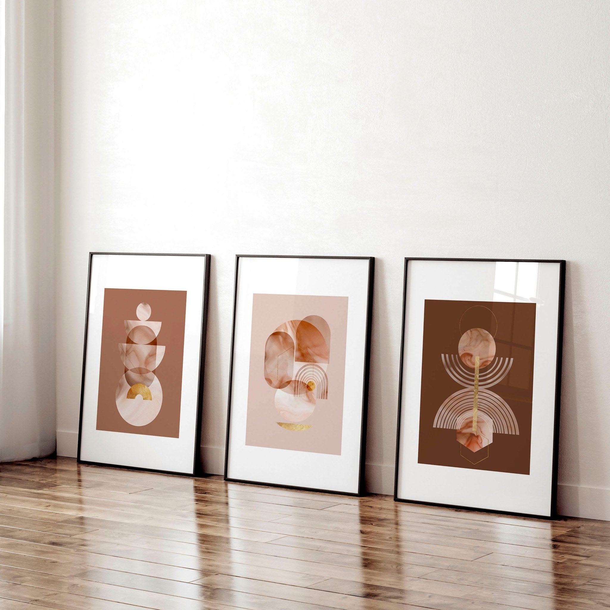 Set of 3 framed wall art prints featuring mid-century designs in Terracotta, Peach, and Muted Gold colors, perfect for office decor.