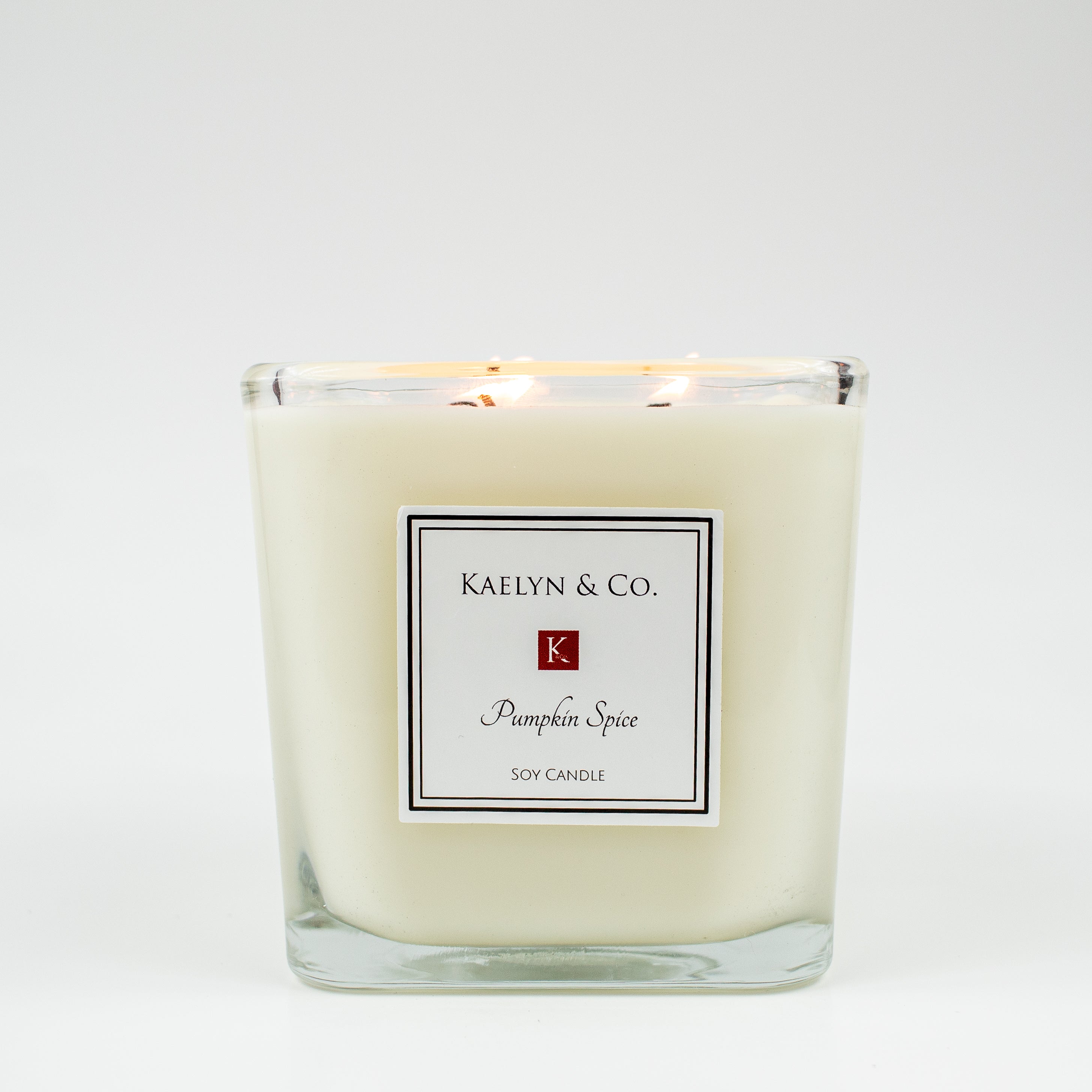 Pumpkin Spice Large Cube Soy Candle with three wicks, showcasing its elegant cube shape and warm autumn colors.