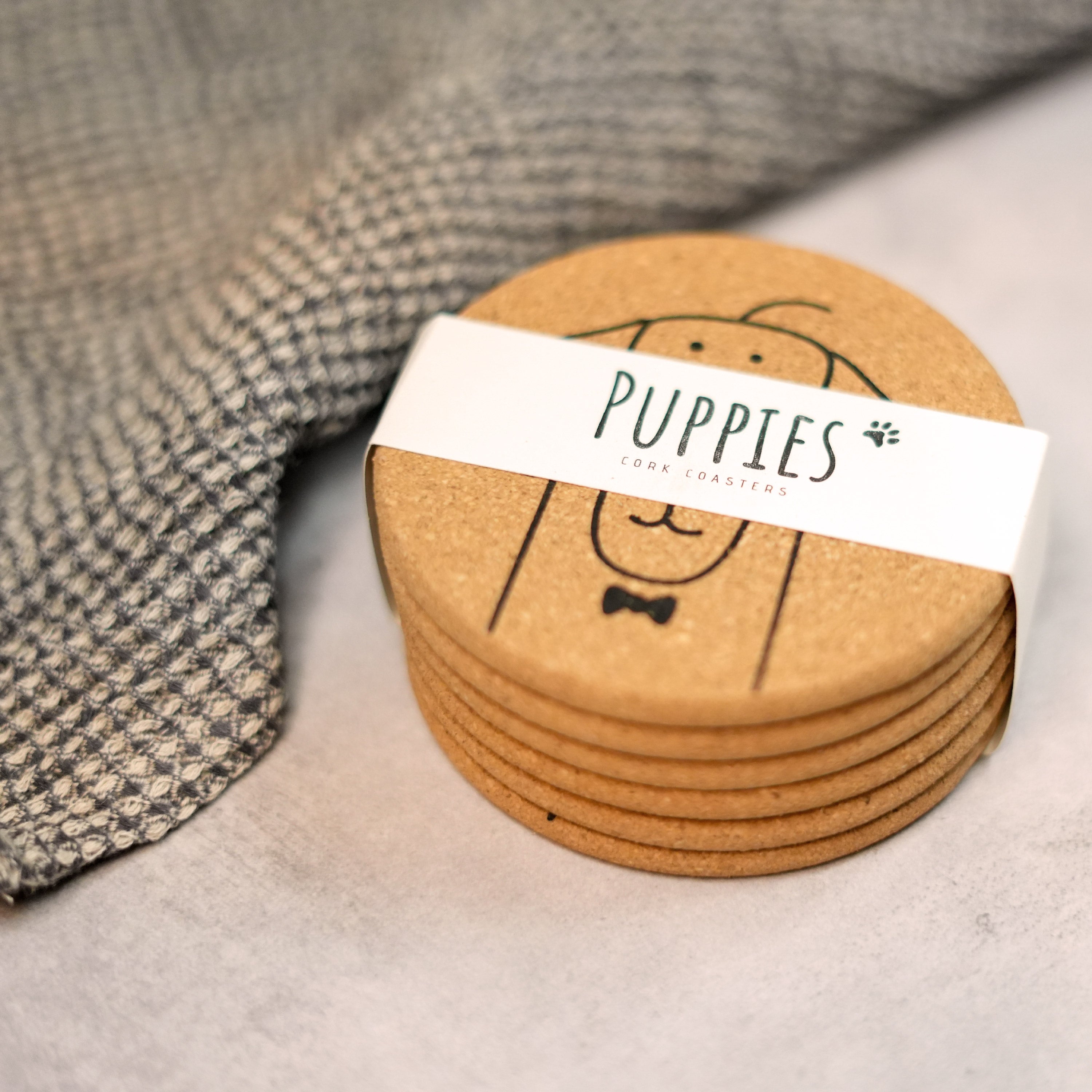 Set of 6 round cork coasters featuring cute dog designs including Saint Bernards, Labrador Retrievers, and more.