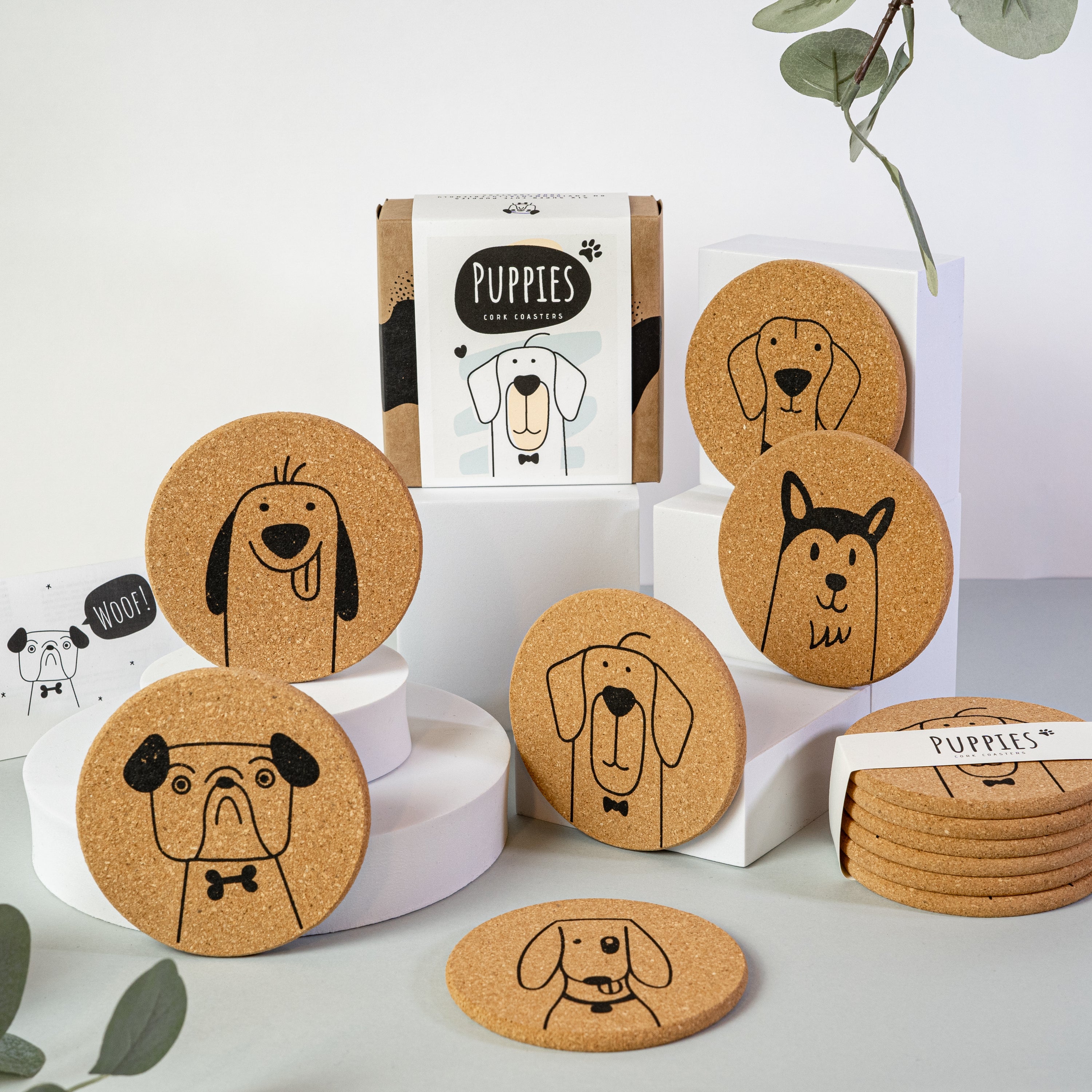 Set of 6 round cork coasters featuring cute dog designs including Saint Bernards, Labrador Retrievers, and more.
