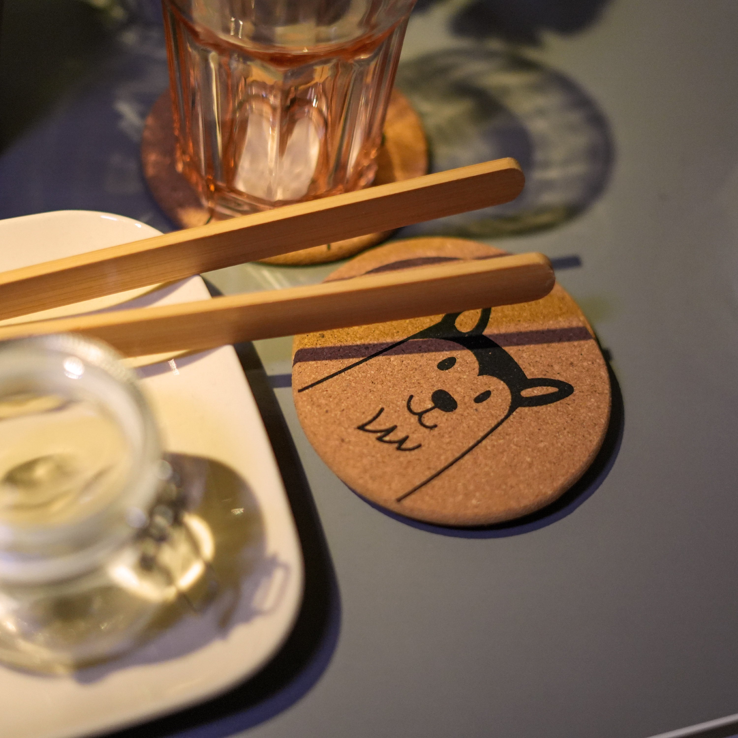 Set of 6 round cork coasters featuring cute dog designs including Saint Bernards, Labrador Retrievers, and more.