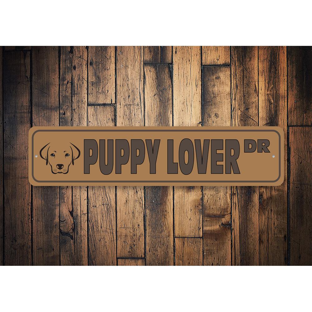 A colorful Puppy Street Sign made of durable aluminum, featuring a playful dog design, perfect for home decor.