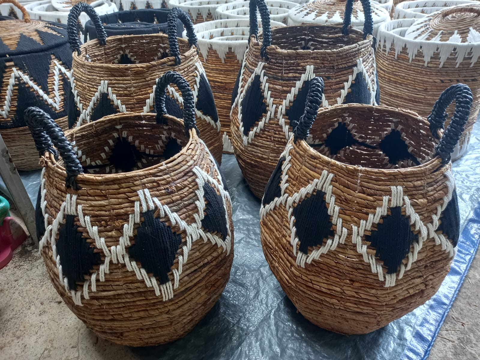 Railaco Basket - S, an oval cotton basket with natural handles, ideal for home organization and decor.
