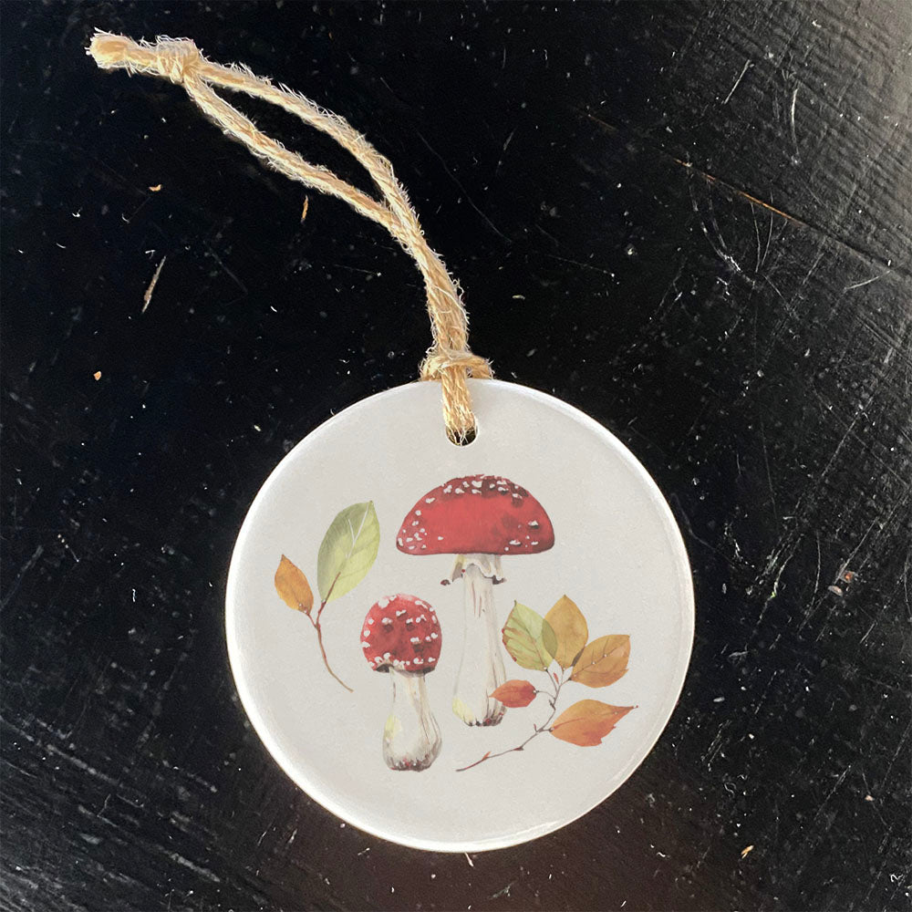 A beautifully crafted Red Capped Mushrooms porcelain ornament featuring vibrant colors and a glossy finish, perfect for home decor or gifting.