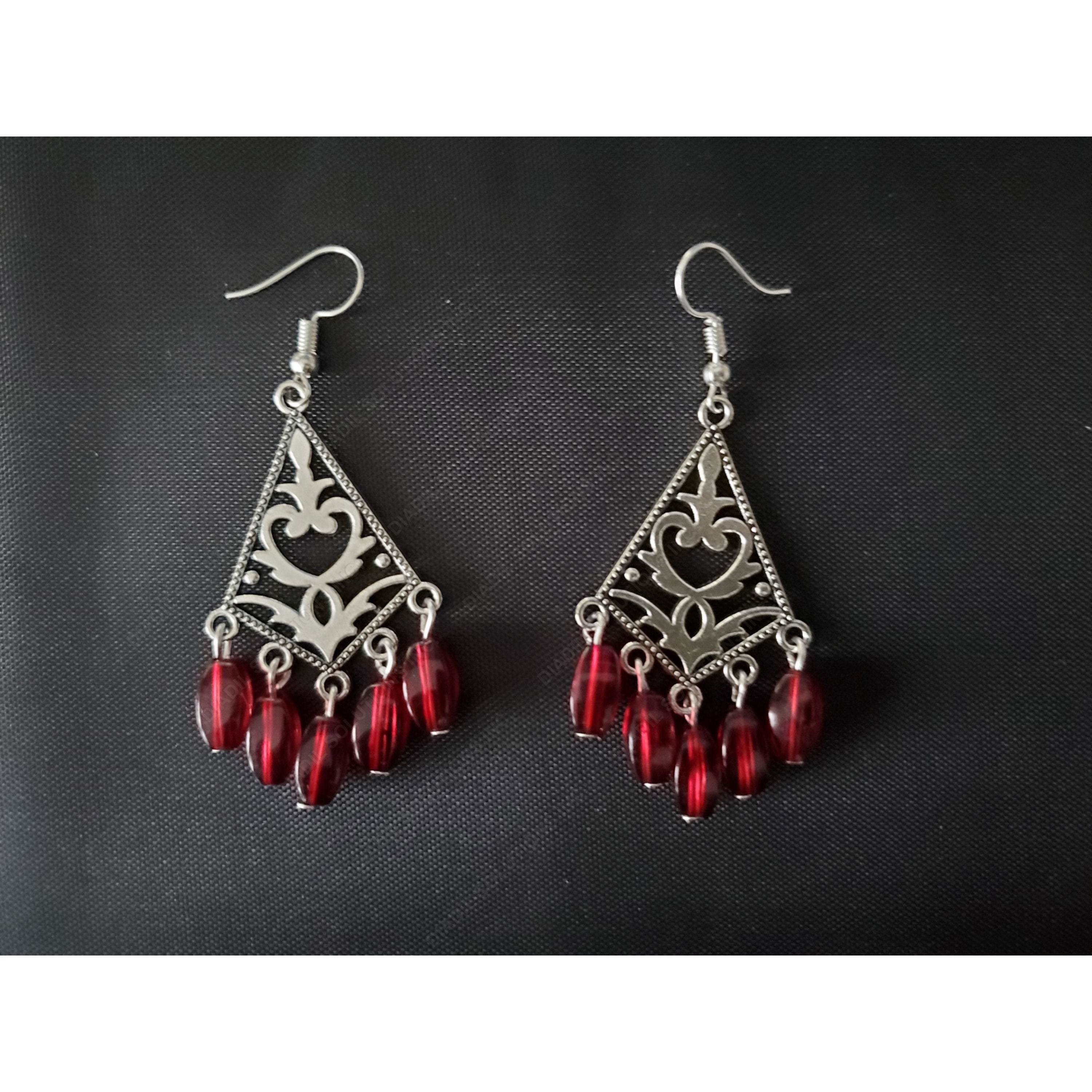 Elegant red dangling earrings with a translucent design, perfect for any occasion.