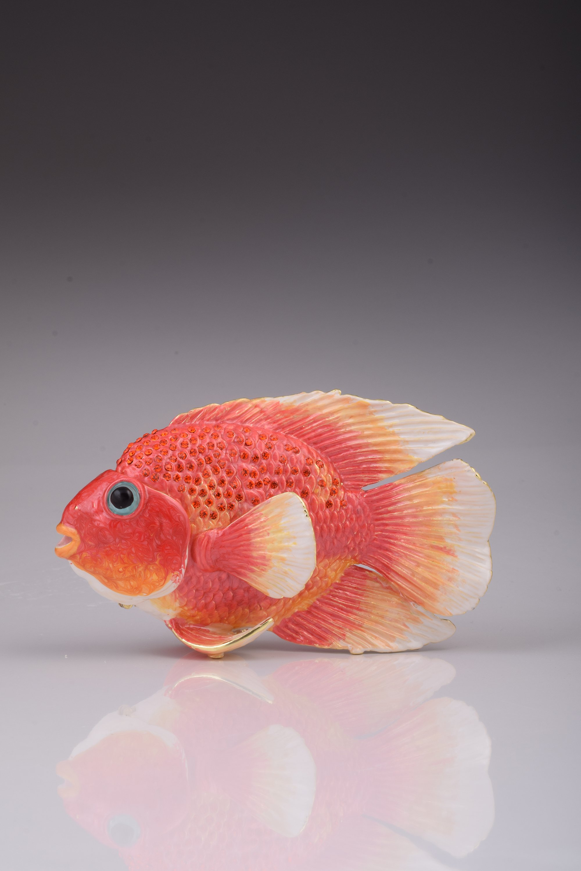 A beautifully handcrafted red fish trinket box adorned with blue Austrian crystals and 925 silver plating, showcasing intricate details.