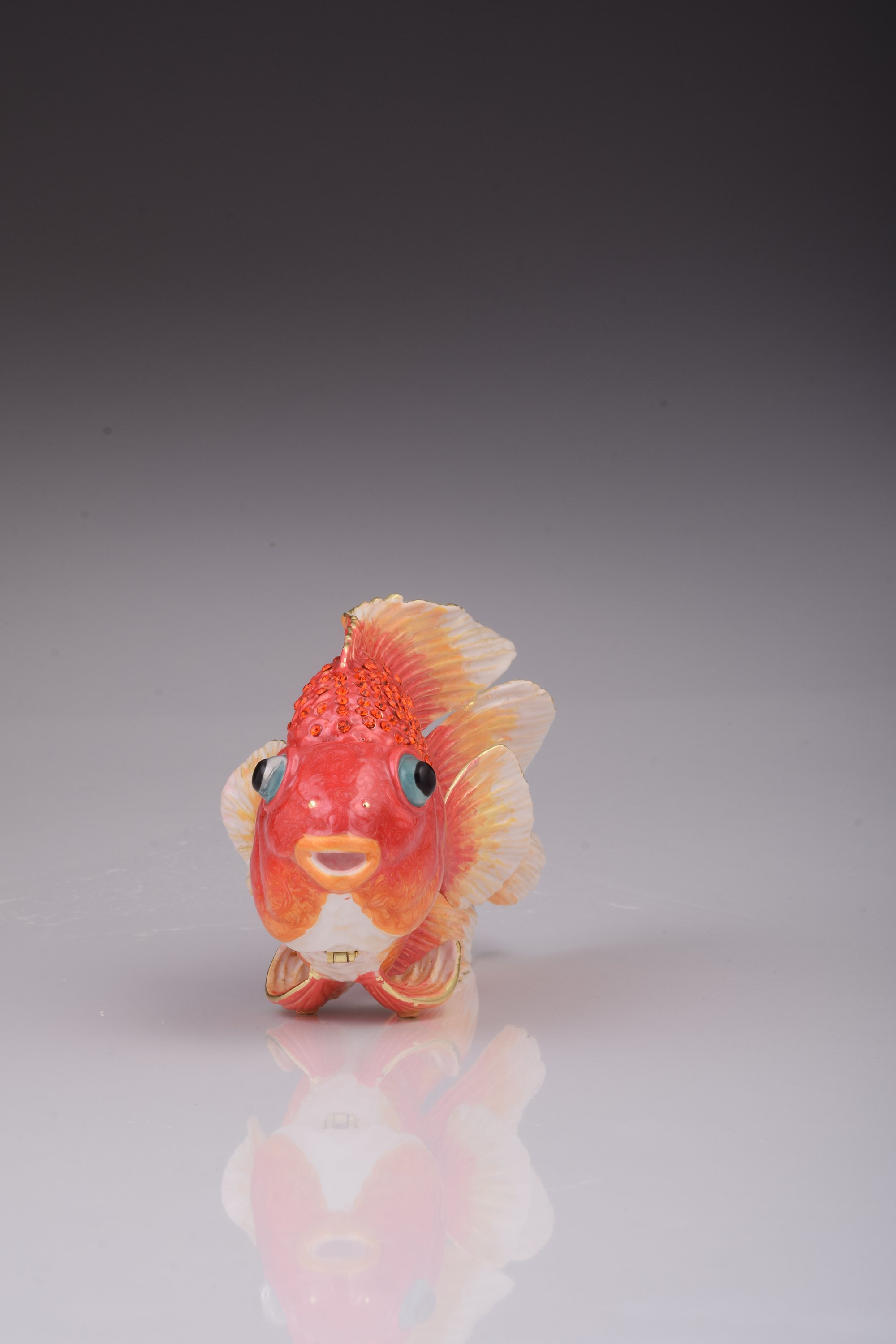 A beautifully handcrafted red fish trinket box adorned with blue Austrian crystals and 925 silver plating, showcasing intricate details.