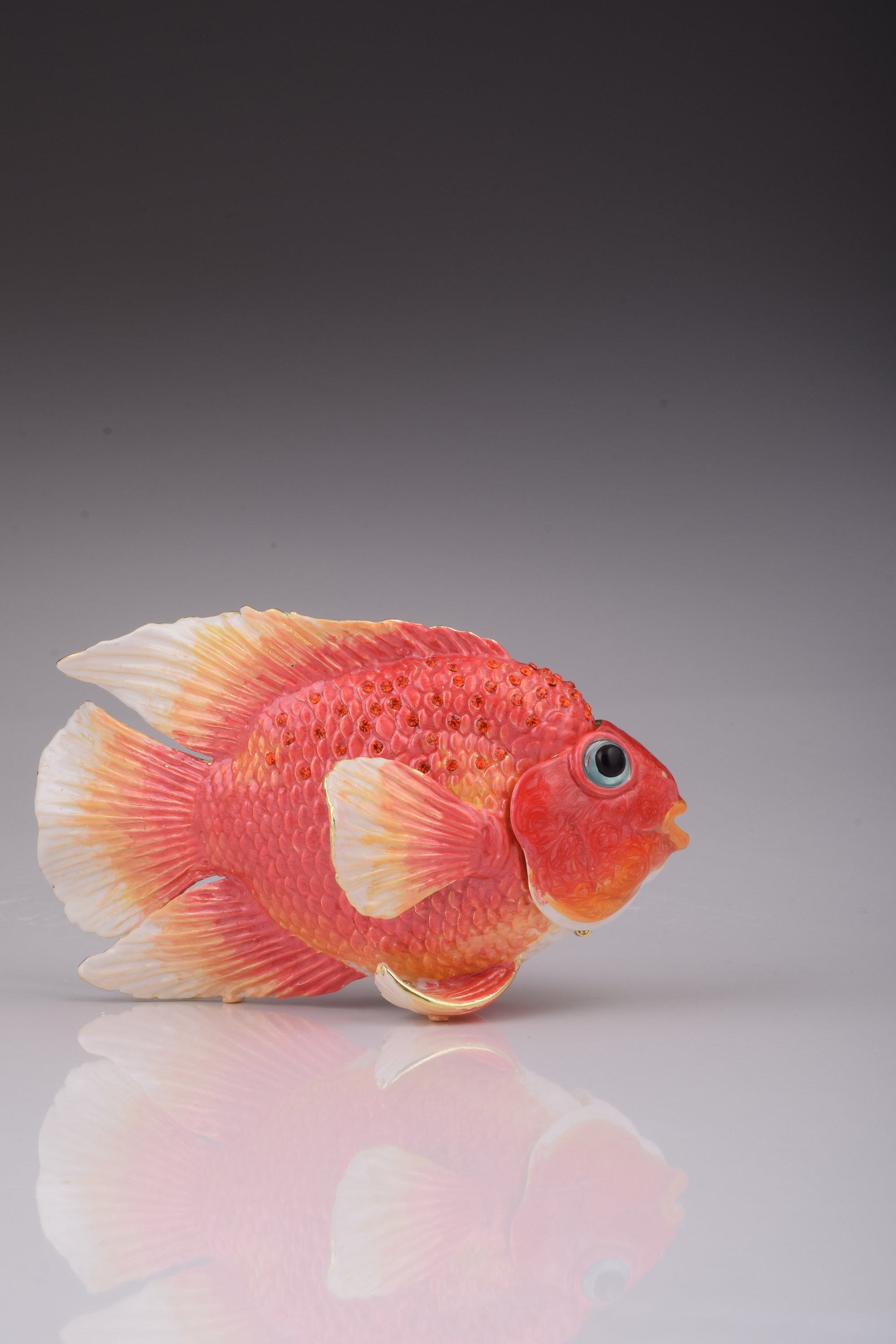 A beautifully handcrafted red fish trinket box adorned with blue Austrian crystals and 925 silver plating, showcasing intricate details.