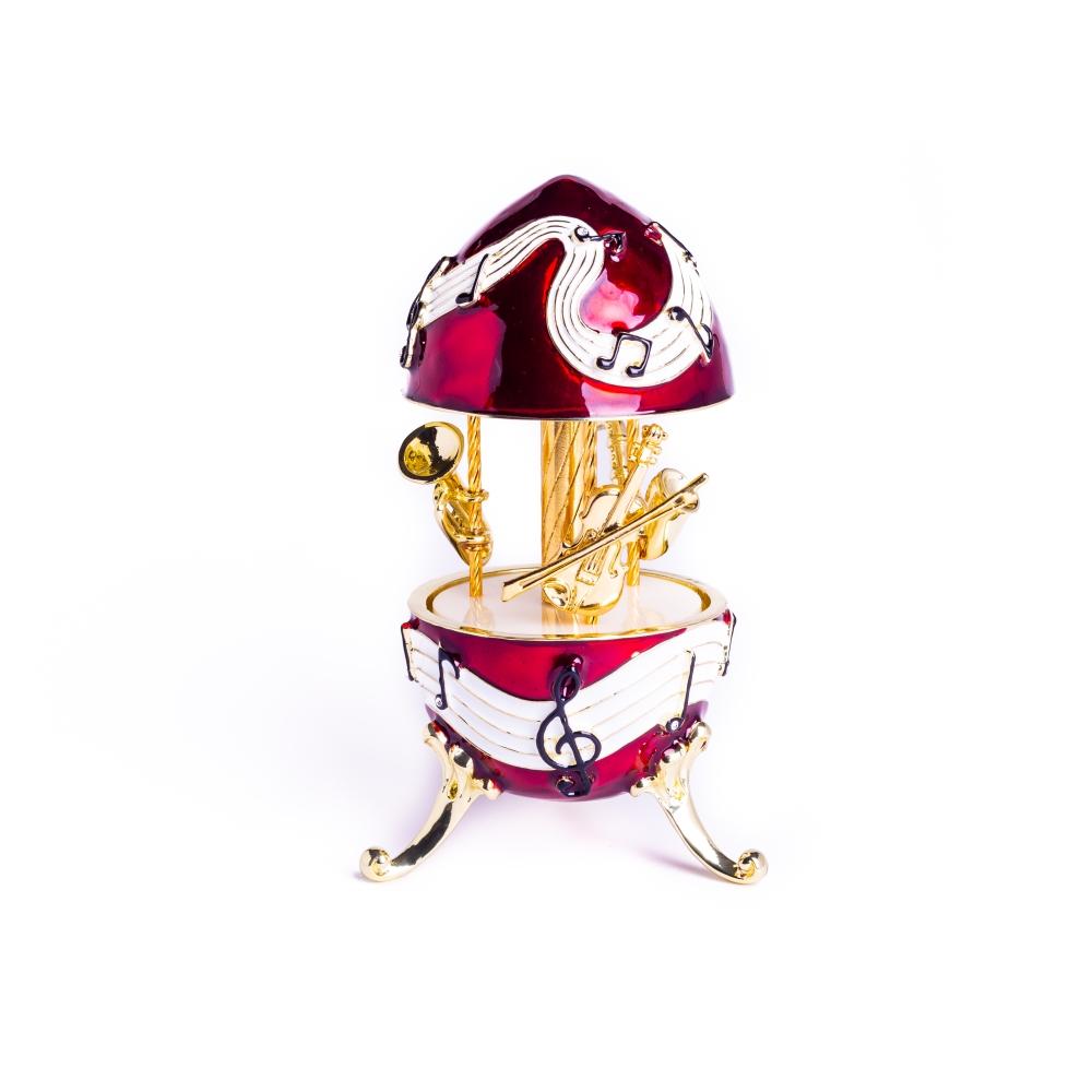 Red Musical Carousel trinket box featuring violin, saxophone, and trumpet designs, adorned with Austrian crystals and gold or silver plating.