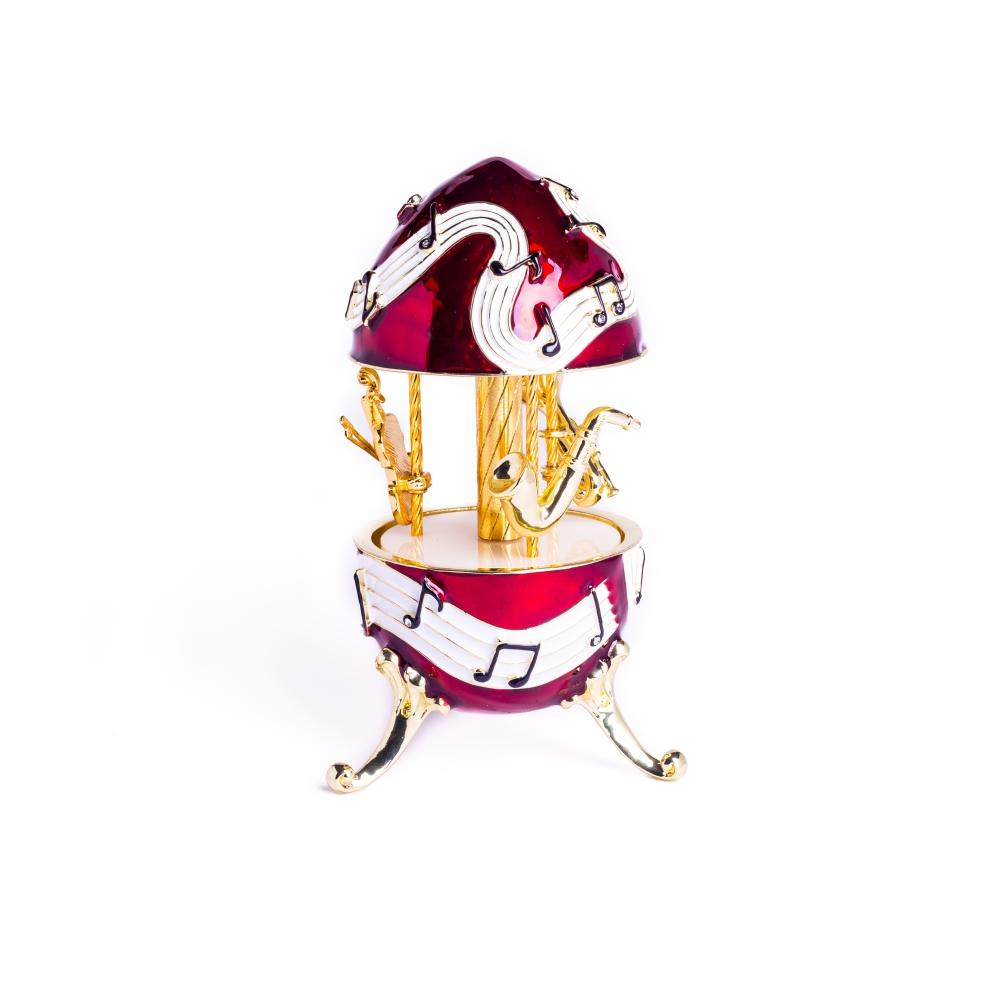 Red Musical Carousel trinket box featuring violin, saxophone, and trumpet designs, adorned with Austrian crystals and gold or silver plating.