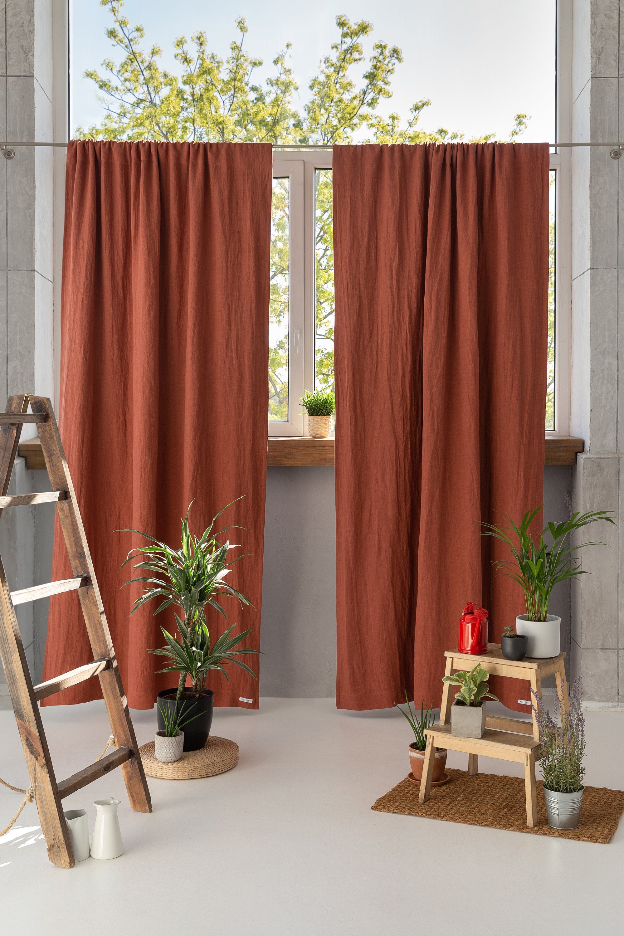 Reddish brown linen curtain with blackout feature, elegantly draped with a rod pocket for easy hanging.