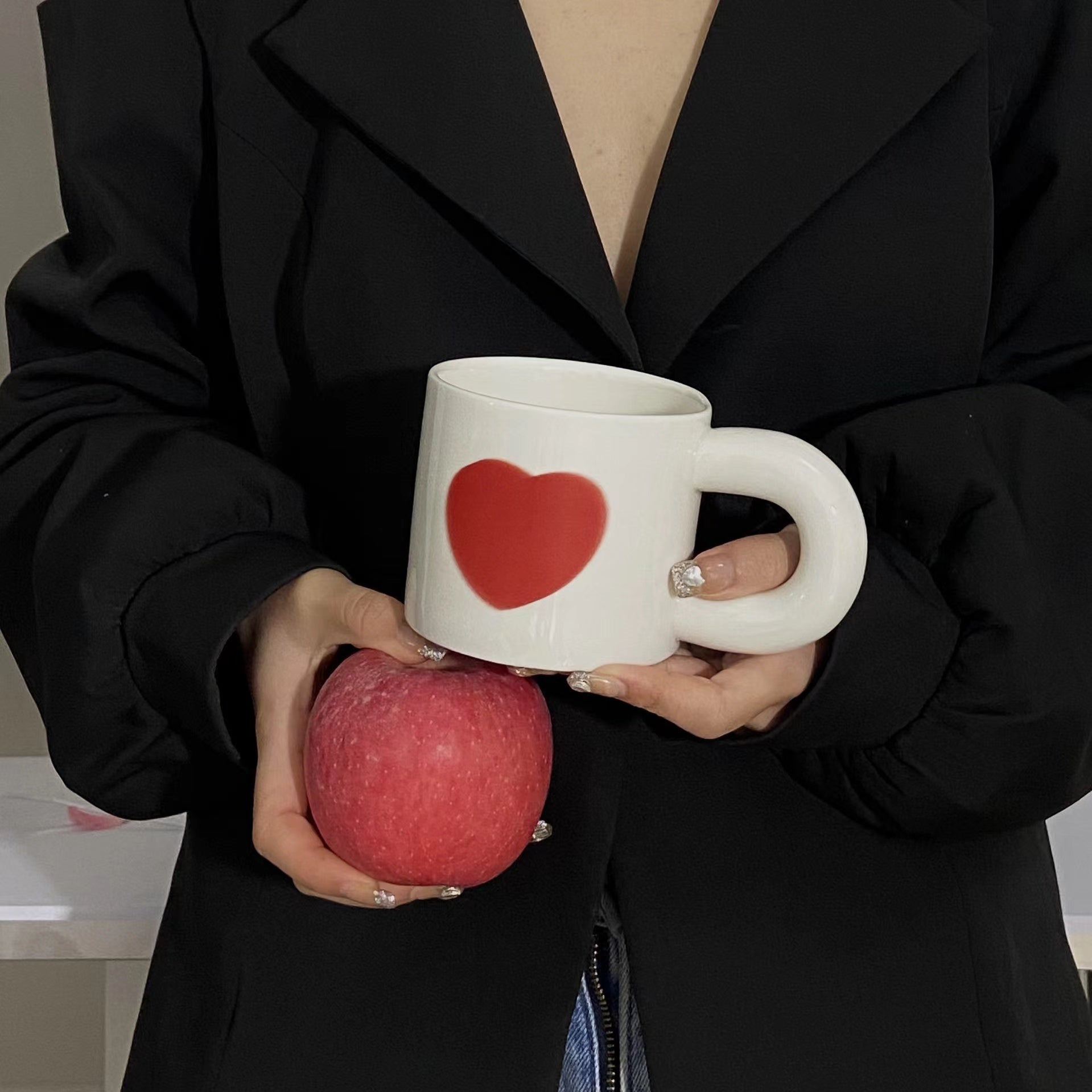 A set of colorful retro ceramic coffee mugs featuring heart prints, showcasing their unique vintage style and handcrafted quality.