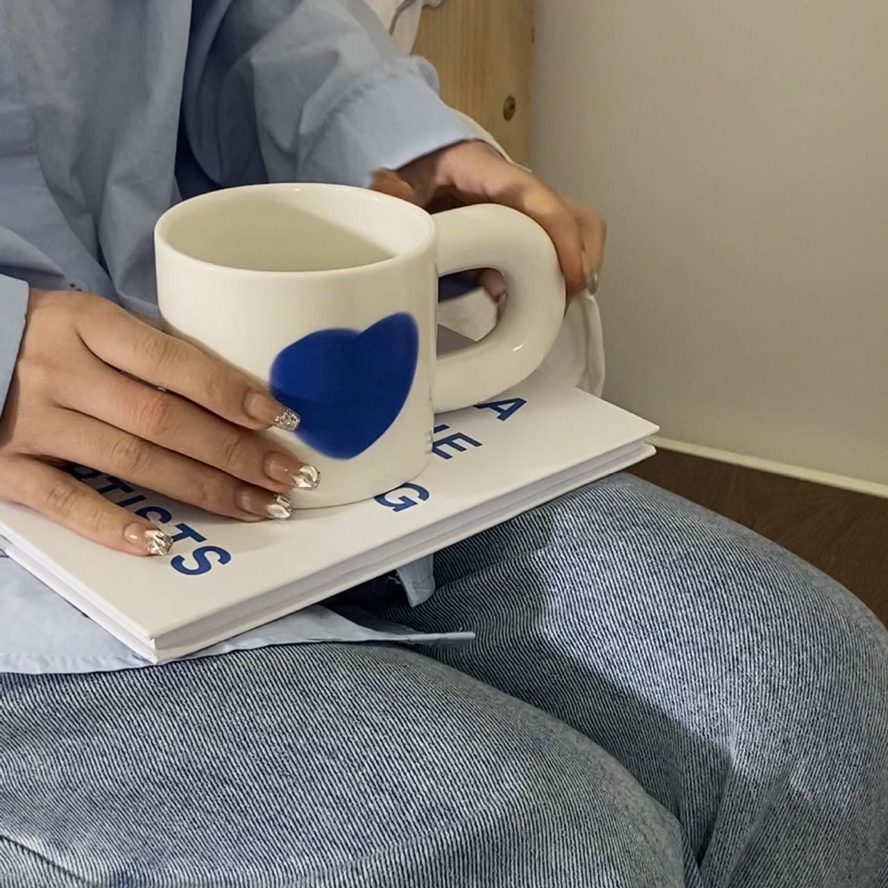 A set of colorful retro ceramic coffee mugs featuring heart prints, showcasing their unique vintage style and handcrafted quality.