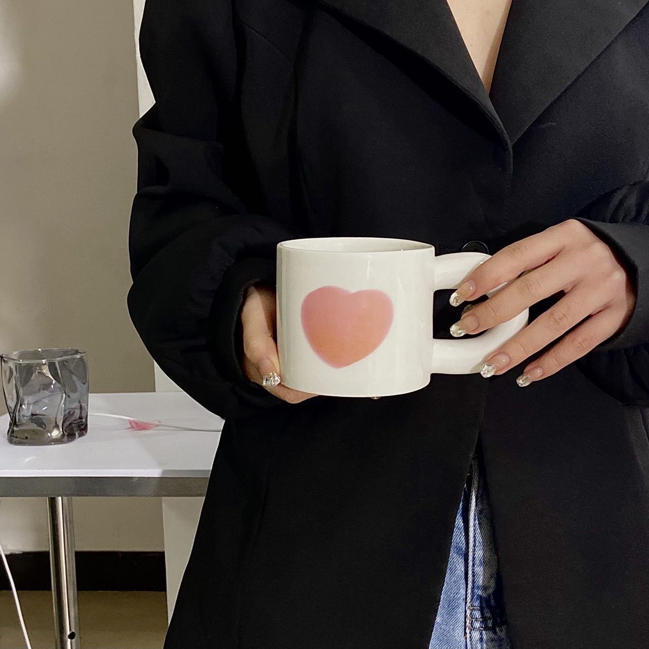 A set of colorful retro ceramic coffee mugs featuring heart prints, showcasing their unique vintage style and handcrafted quality.