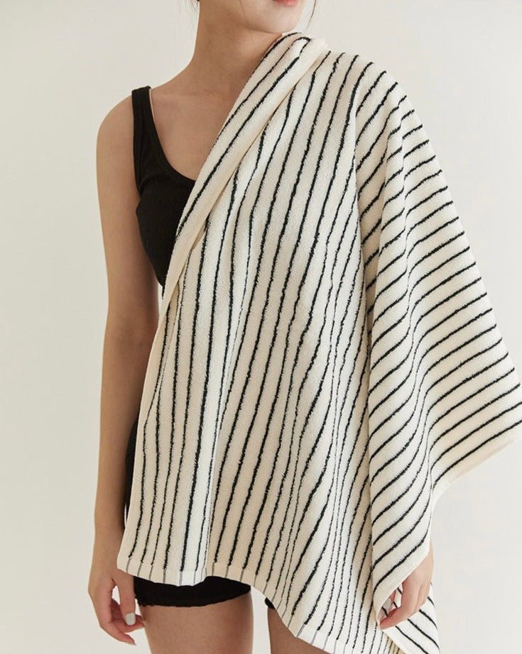 A luxurious Retro Style 100% Organic Combed Cotton Striped Bath Towel, showcasing its soft texture and vibrant striped design.