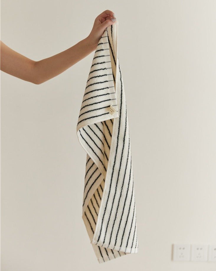 A luxurious Retro Style 100% Organic Combed Cotton Striped Bath Towel, showcasing its soft texture and vibrant striped design.