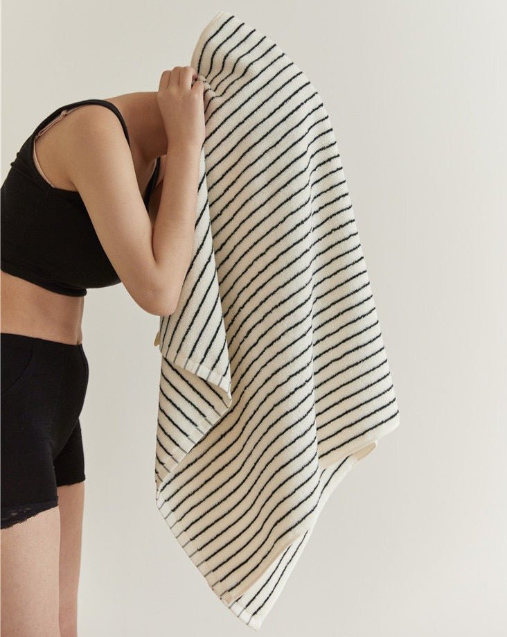A luxurious Retro Style 100% Organic Combed Cotton Striped Bath Towel, showcasing its soft texture and vibrant striped design.