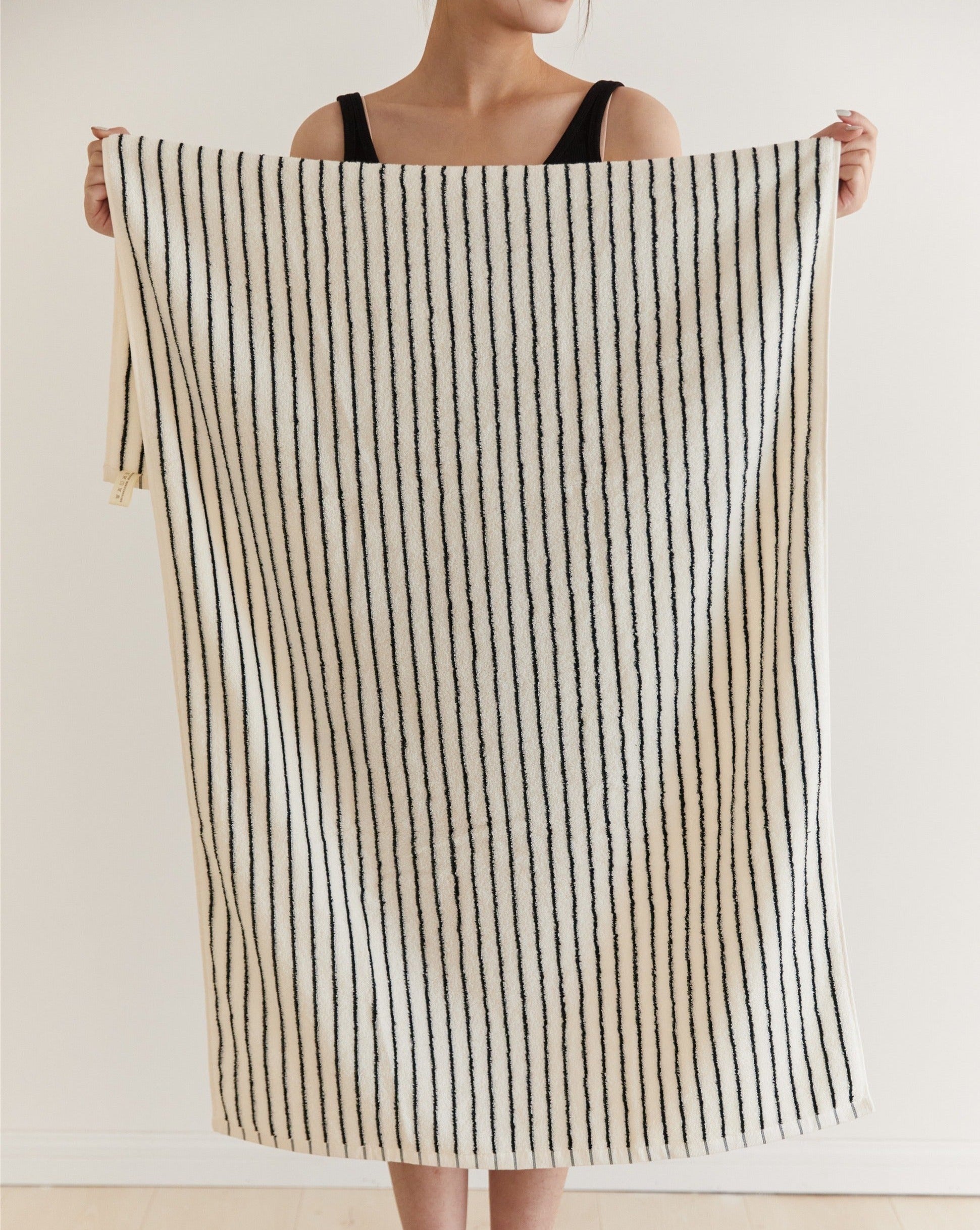 A luxurious Retro Style 100% Organic Combed Cotton Striped Bath Towel, showcasing its soft texture and vibrant striped design.