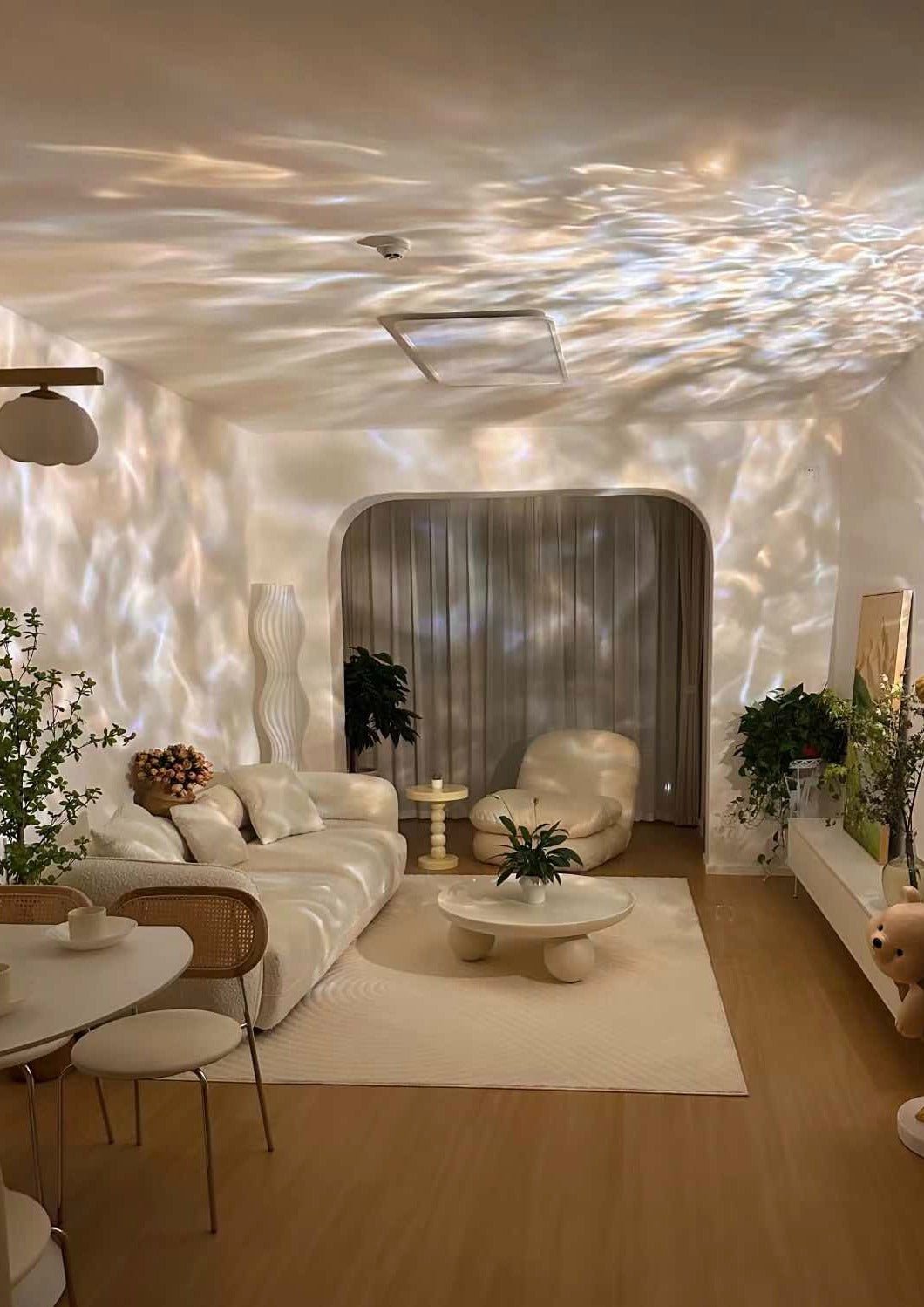 Ripple Projector Decorative Table Lamp showcasing dynamic light patterns on a wall, designed for modern ambient lighting.