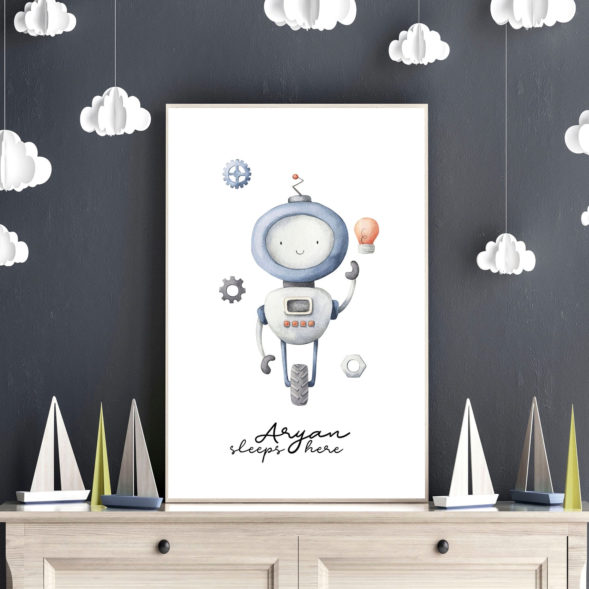 Charming robot-themed wall art print featuring vintage-style illustrations in soft greys and light blue, perfect for a baby boy's playroom.