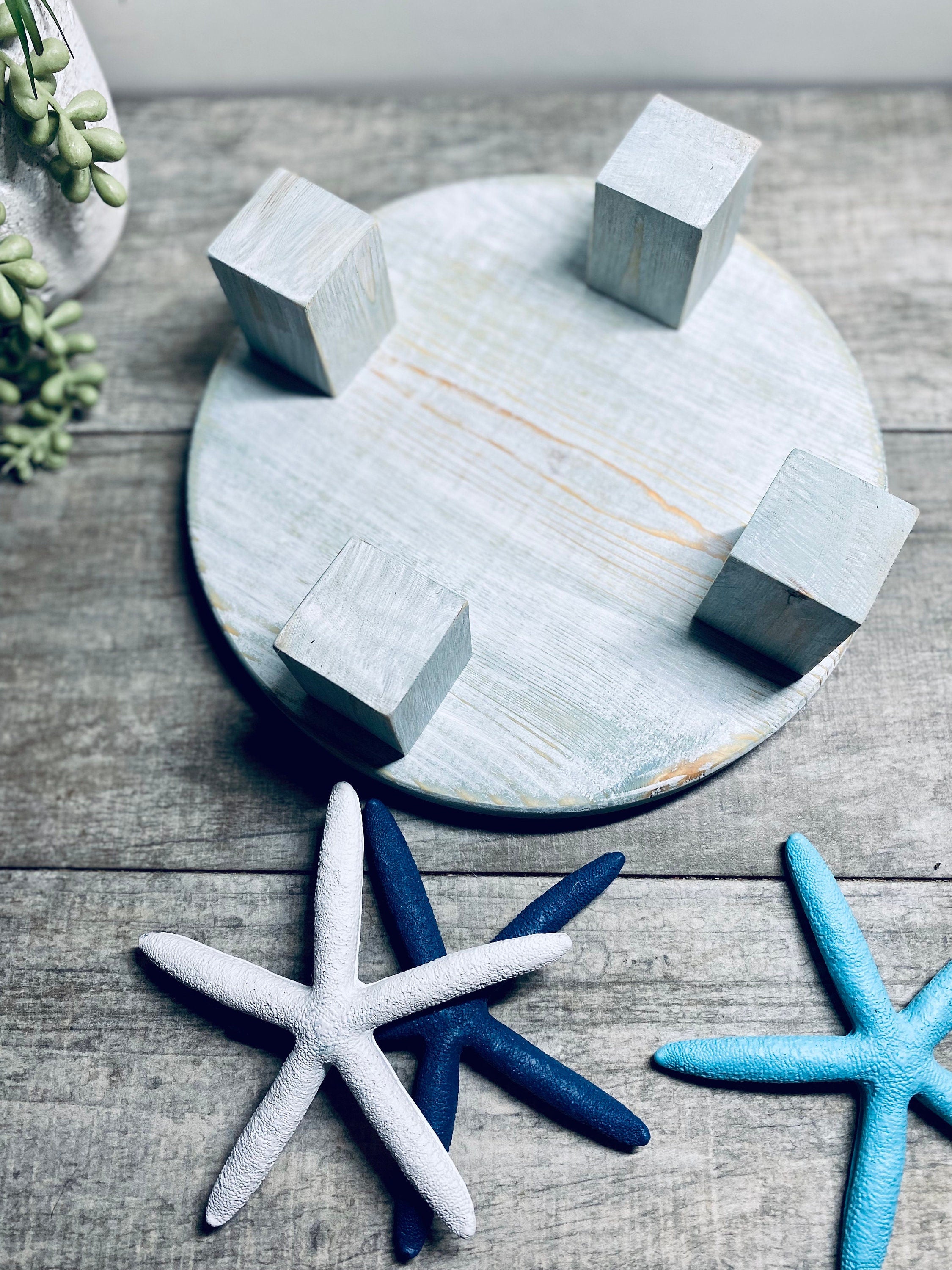 Round Wooden Riser in Vintage Blue with whitewashed finish, showcasing a shabby chic design, perfect for displaying soaps and candles.