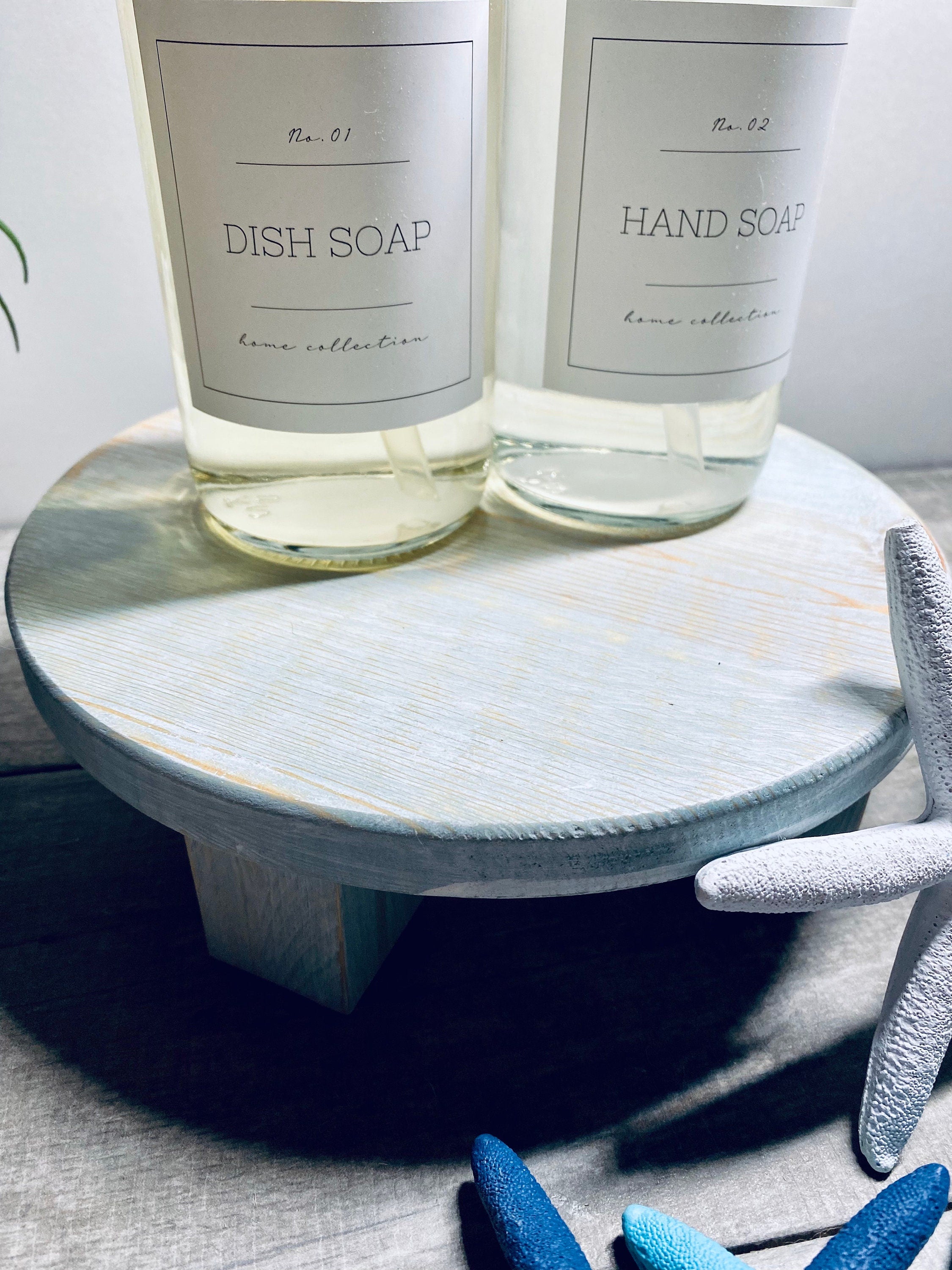 Round Wooden Riser in Vintage Blue with whitewashed finish, showcasing a shabby chic design, perfect for displaying soaps and candles.