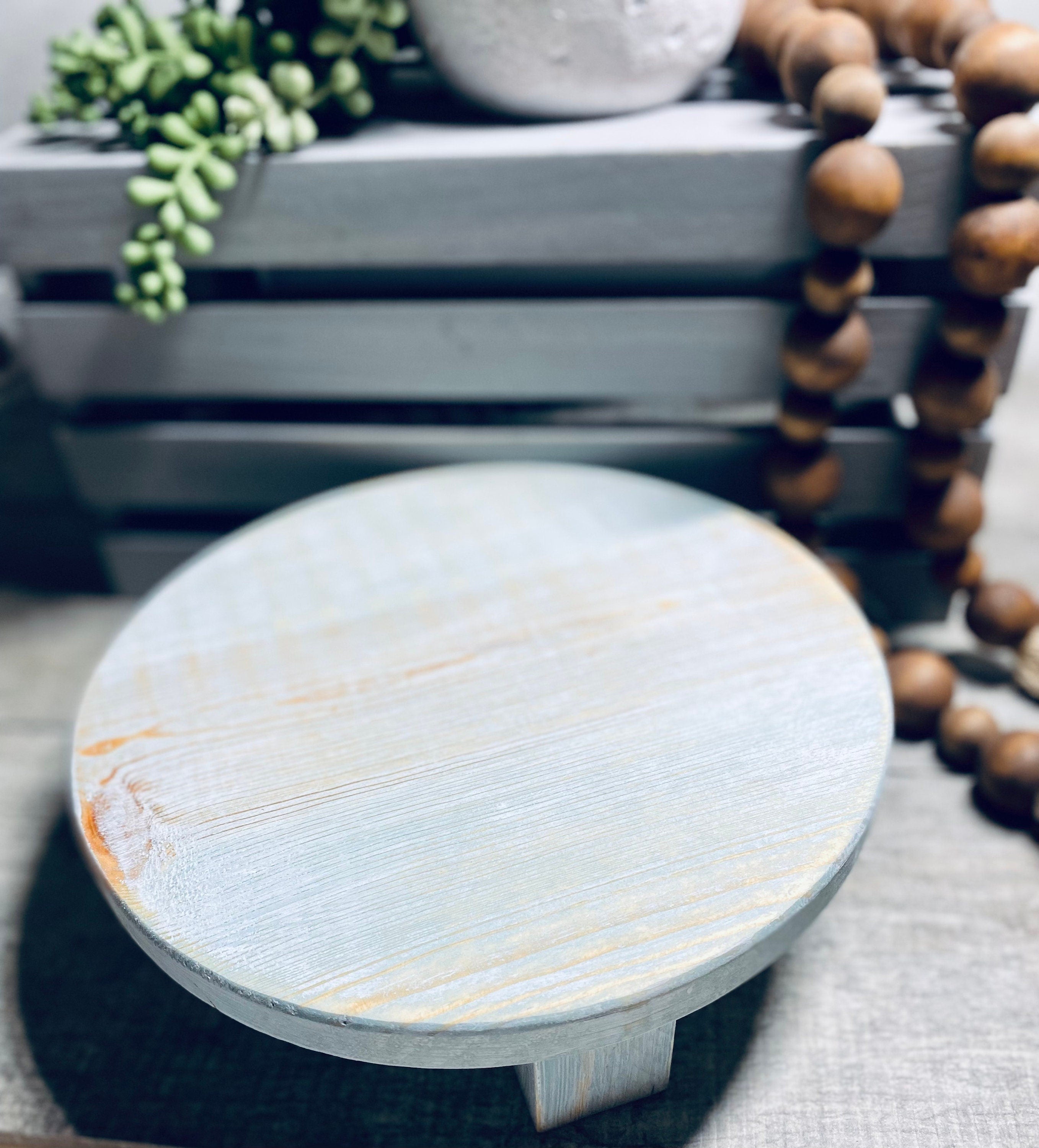 Round Wooden Riser in Vintage Blue with whitewashed finish, showcasing a shabby chic design, perfect for displaying soaps and candles.