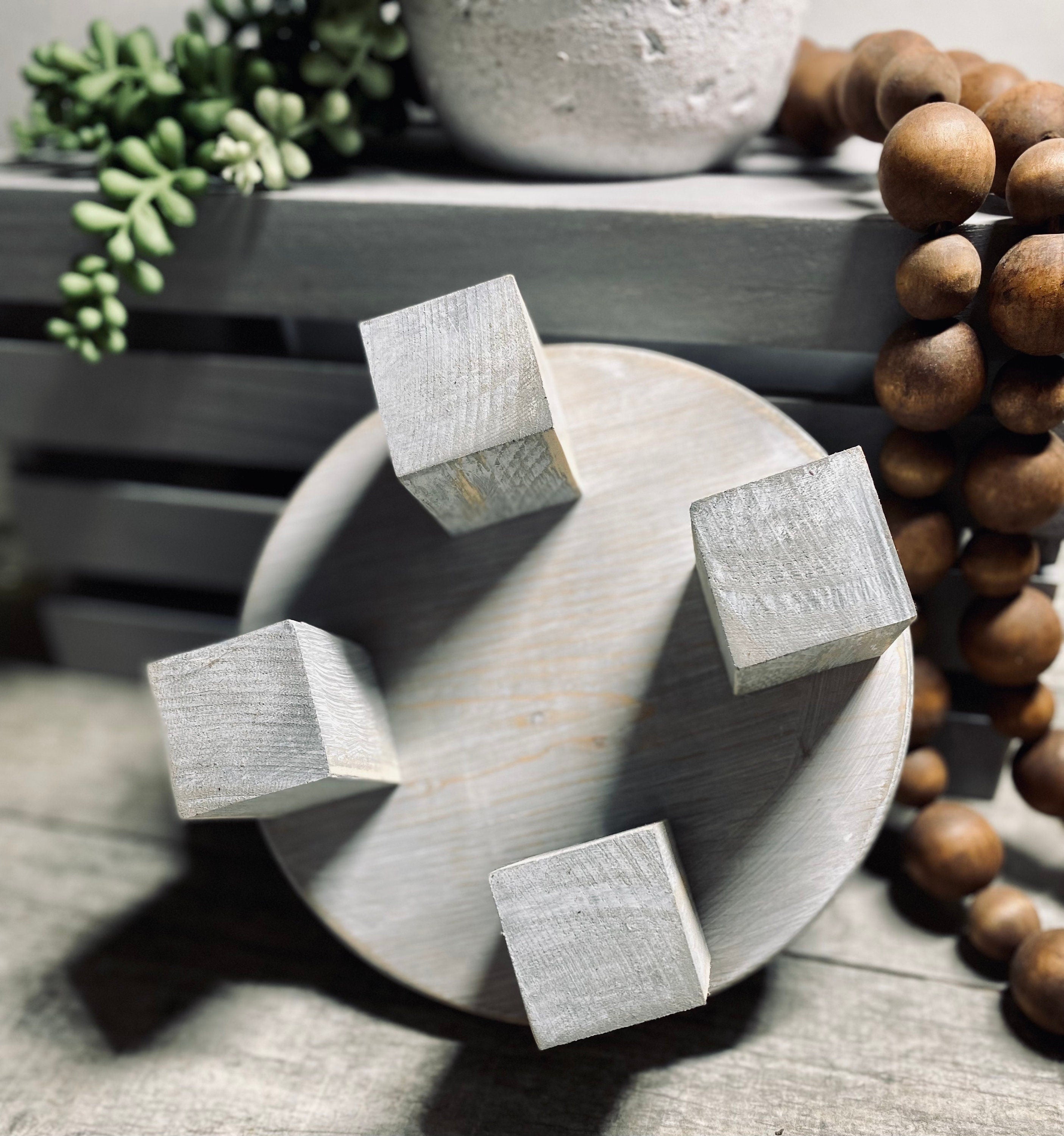 Round wooden riser in Classic Gray with a whitewashed finish, showcasing its rustic charm and sturdy design, perfect for displaying decor items.
