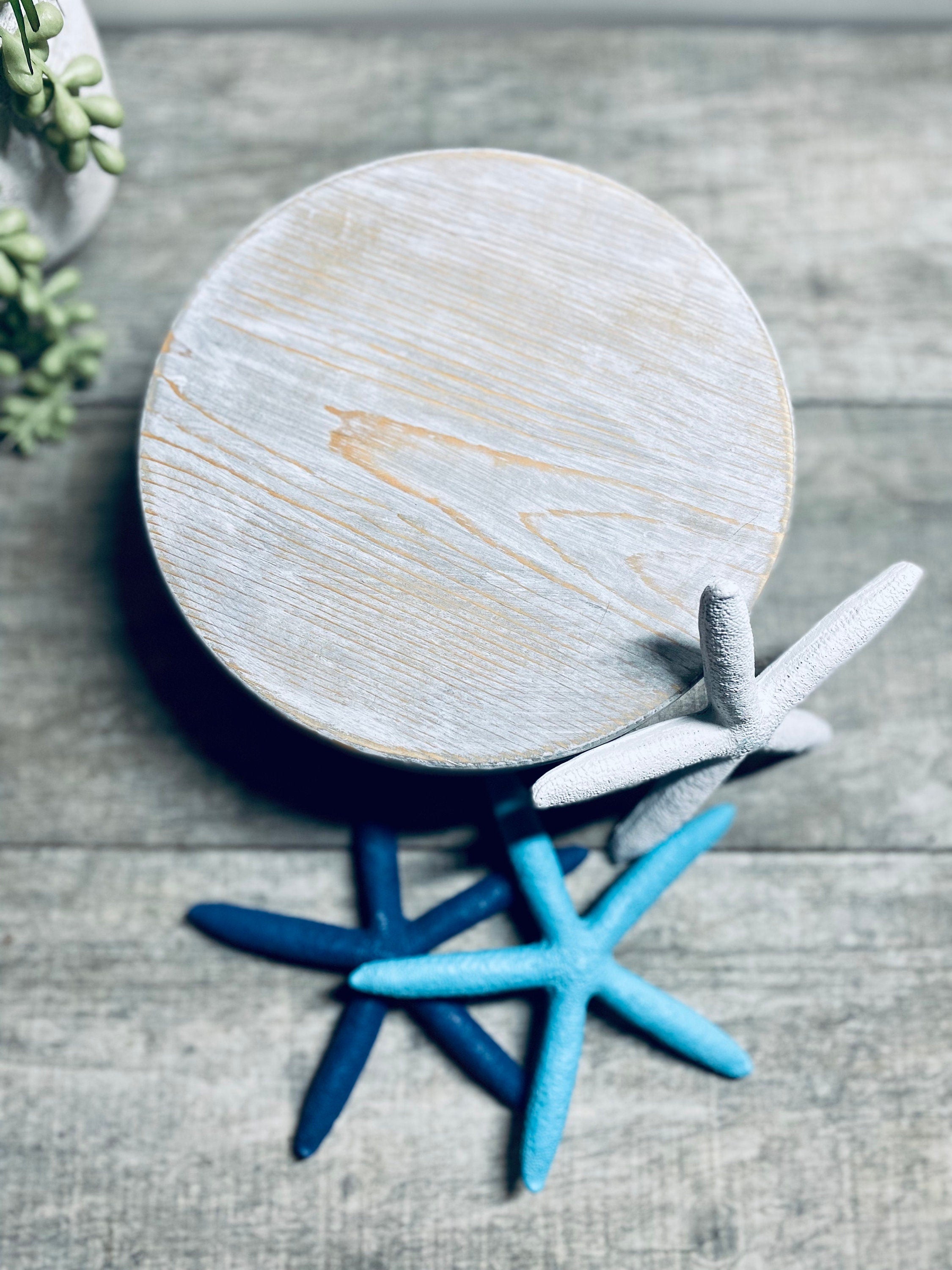 Round wooden riser in Classic Gray with a whitewashed finish, showcasing its rustic charm and sturdy design, perfect for displaying decor items.