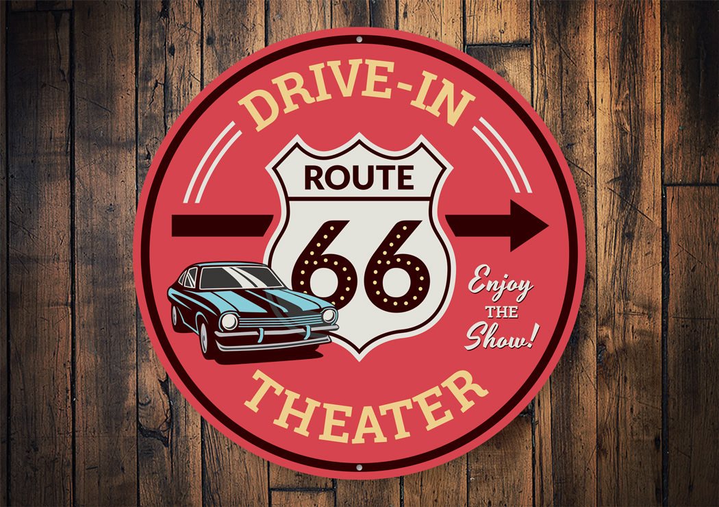 Route 66 Drive-In Theater This Way Sign made of aluminum, featuring vibrant colors and a vintage design, perfect for home decor.
