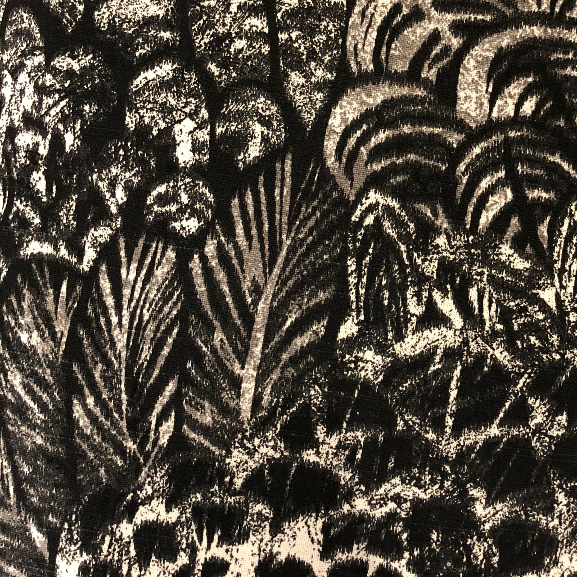 Rowan Gale Black and Beige Luxury Throw Pillow showcasing its elegant design and soft cotton fabric, perfect for home decor.