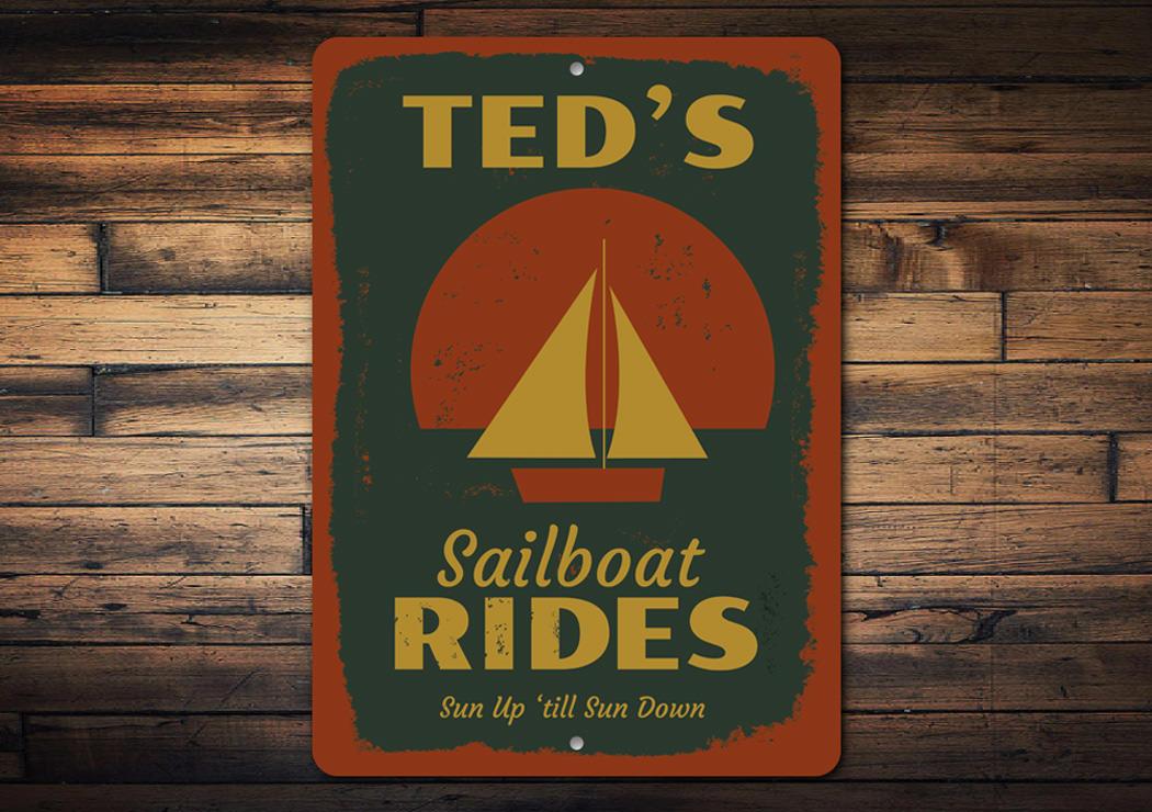 A decorative Sailboat Rides Sign made of high-quality aluminum, featuring a vibrant design perfect for lakehouse decor.