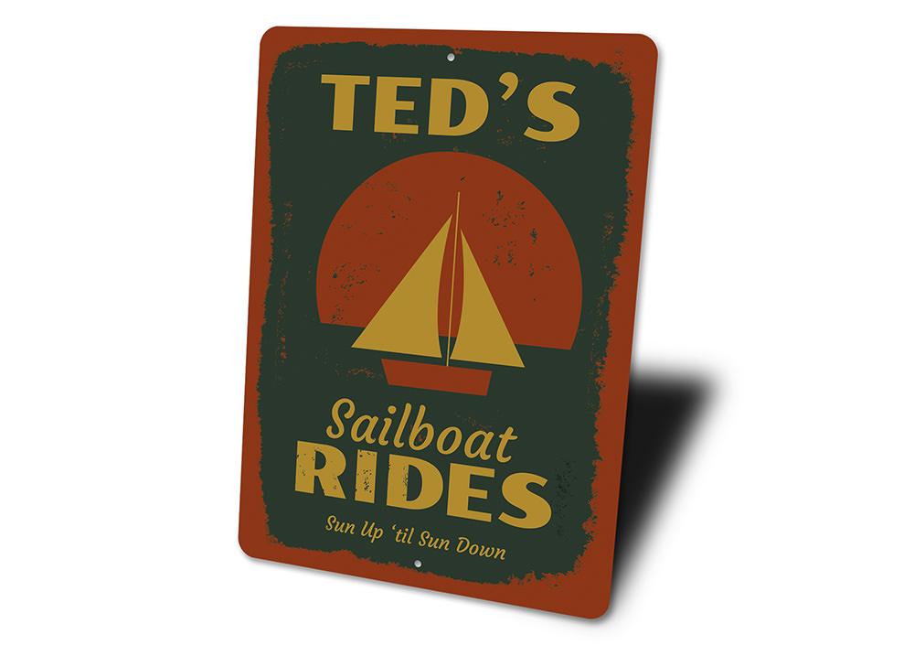 A decorative Sailboat Rides Sign made of high-quality aluminum, featuring a vibrant design perfect for lakehouse decor.