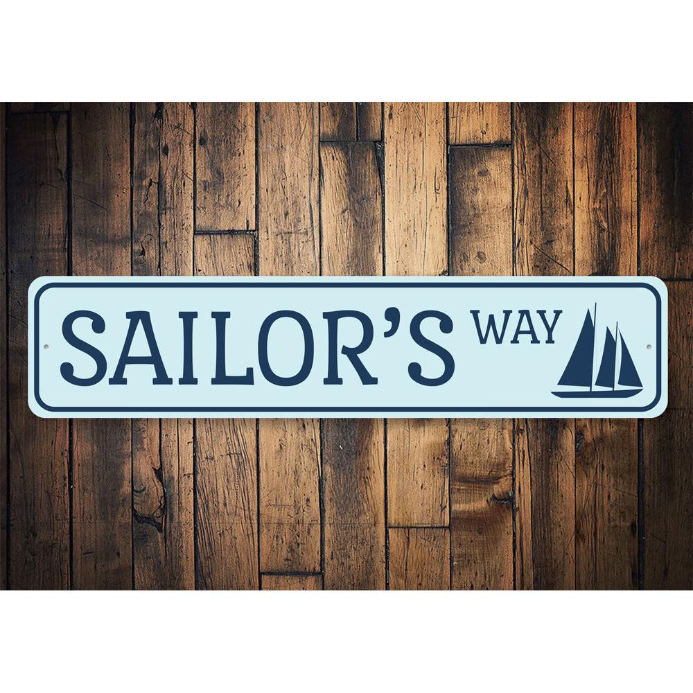 Sailors Way Sign made of high-quality aluminum, featuring nautical design elements, perfect for beach-themed decor.