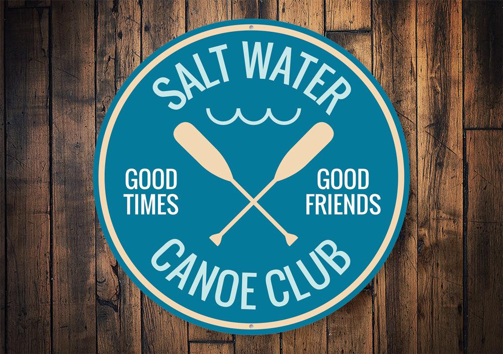 Saltwater Canoe Club Sign made of durable aluminum, featuring customizable text and pre-drilled holes for easy mounting, perfect for beach-themed decor.