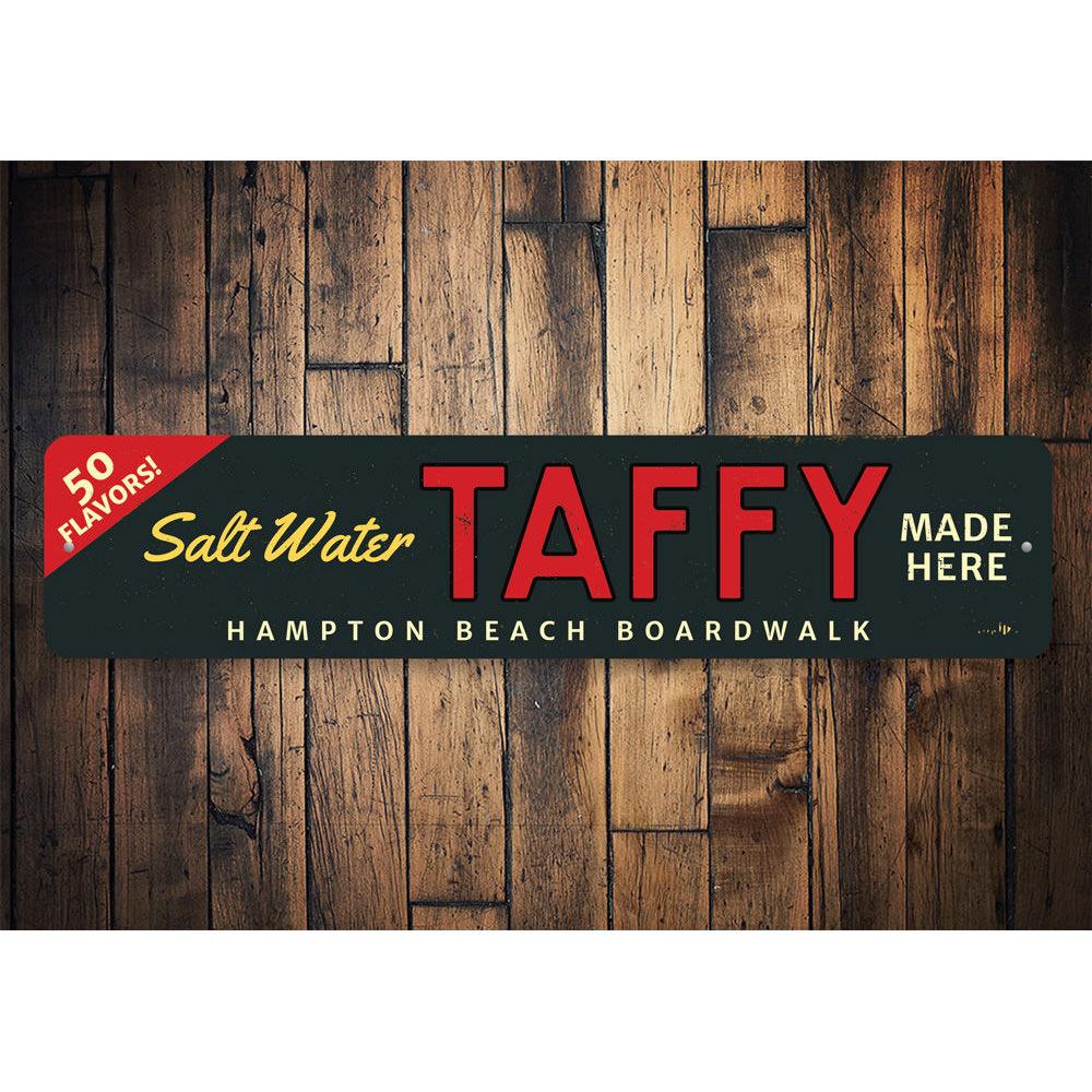 Saltwater Taffy Made Here decorative sign made of high-quality aluminum, featuring customizable text and pre-drilled holes for easy mounting.