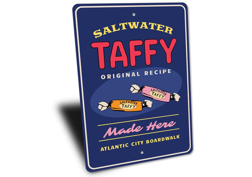 Saltwater Taffy Made Here decorative metal sign, featuring vibrant colors and a beach-themed design, perfect for coastal decor.